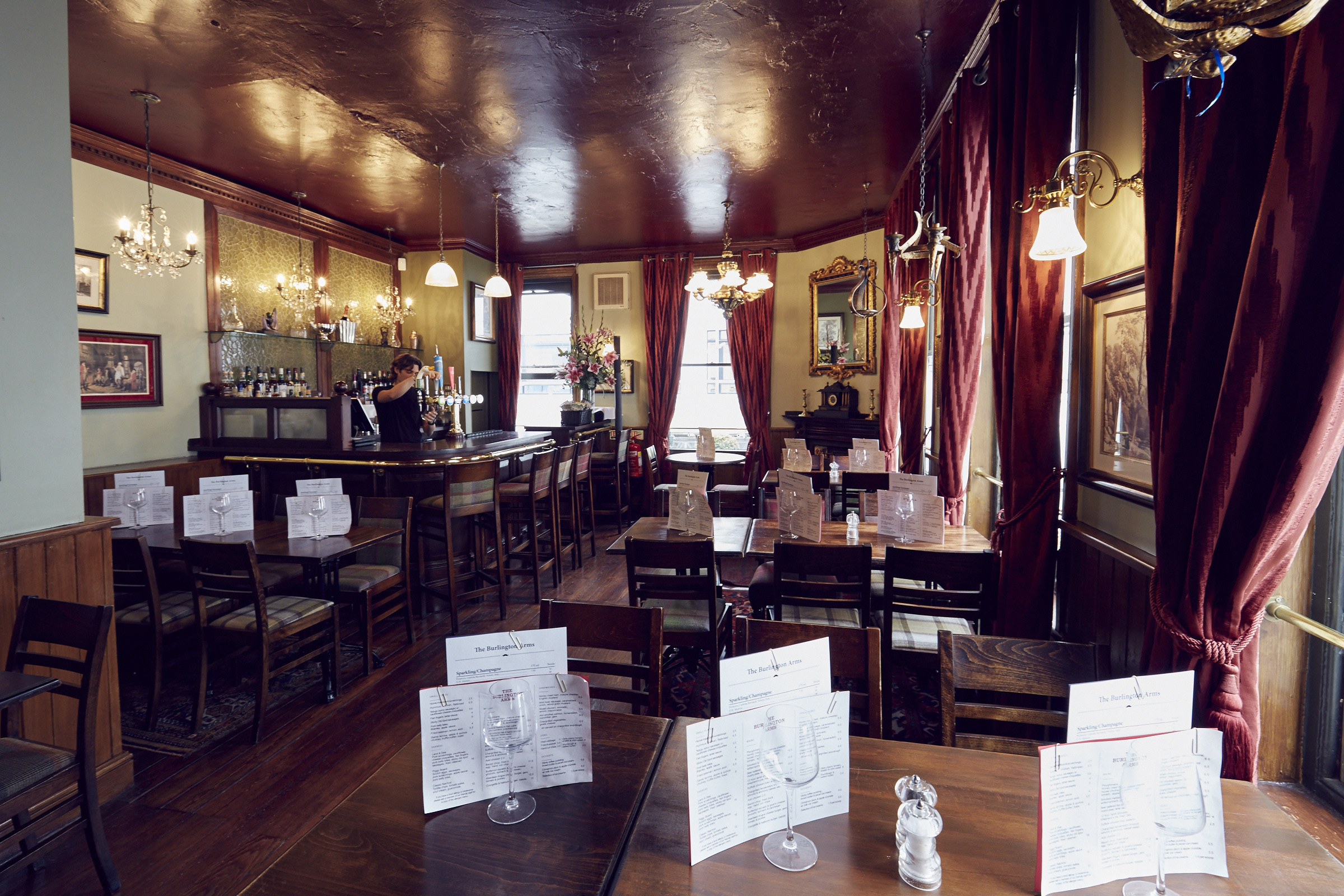 Charming Burlington Arms restaurant with elegant decor, ideal for intimate events and dinners.