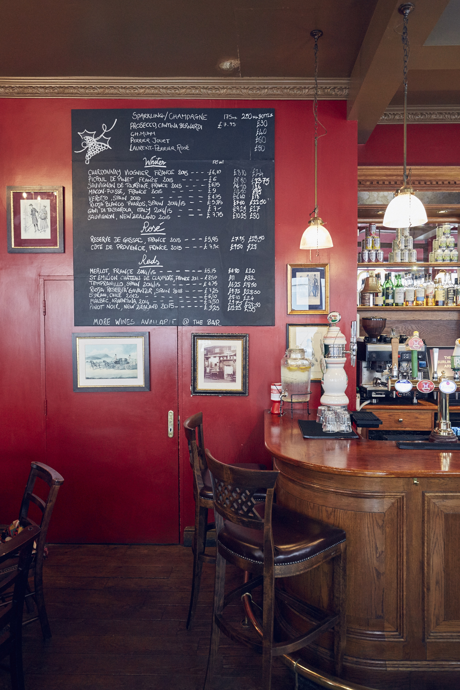 Cozy bar at Burlington Arms with chalkboard menu, perfect for networking events.