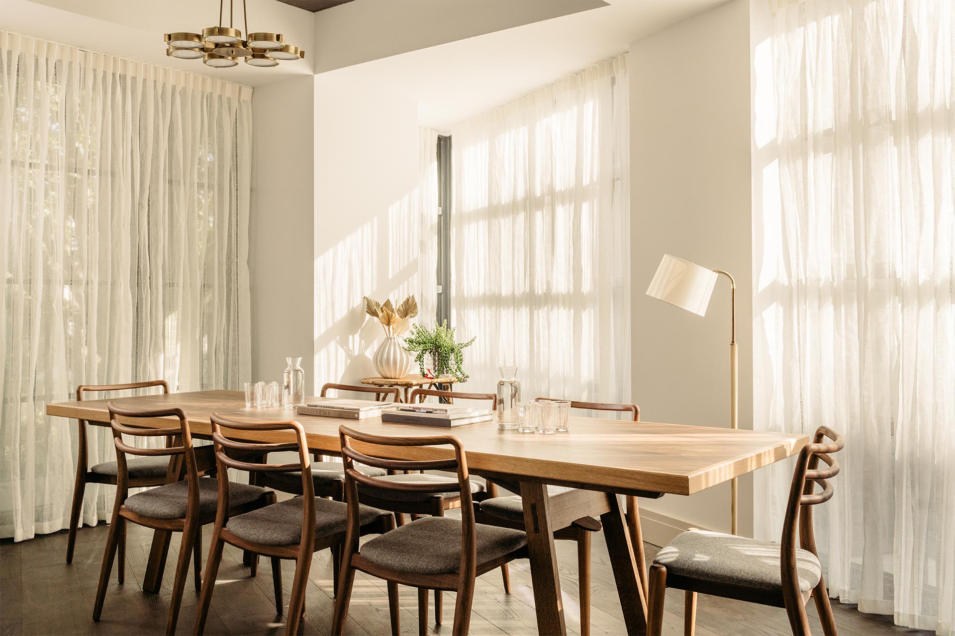 Well-lit meeting space with wooden table and stylish chairs at The Hoxton Southwark.