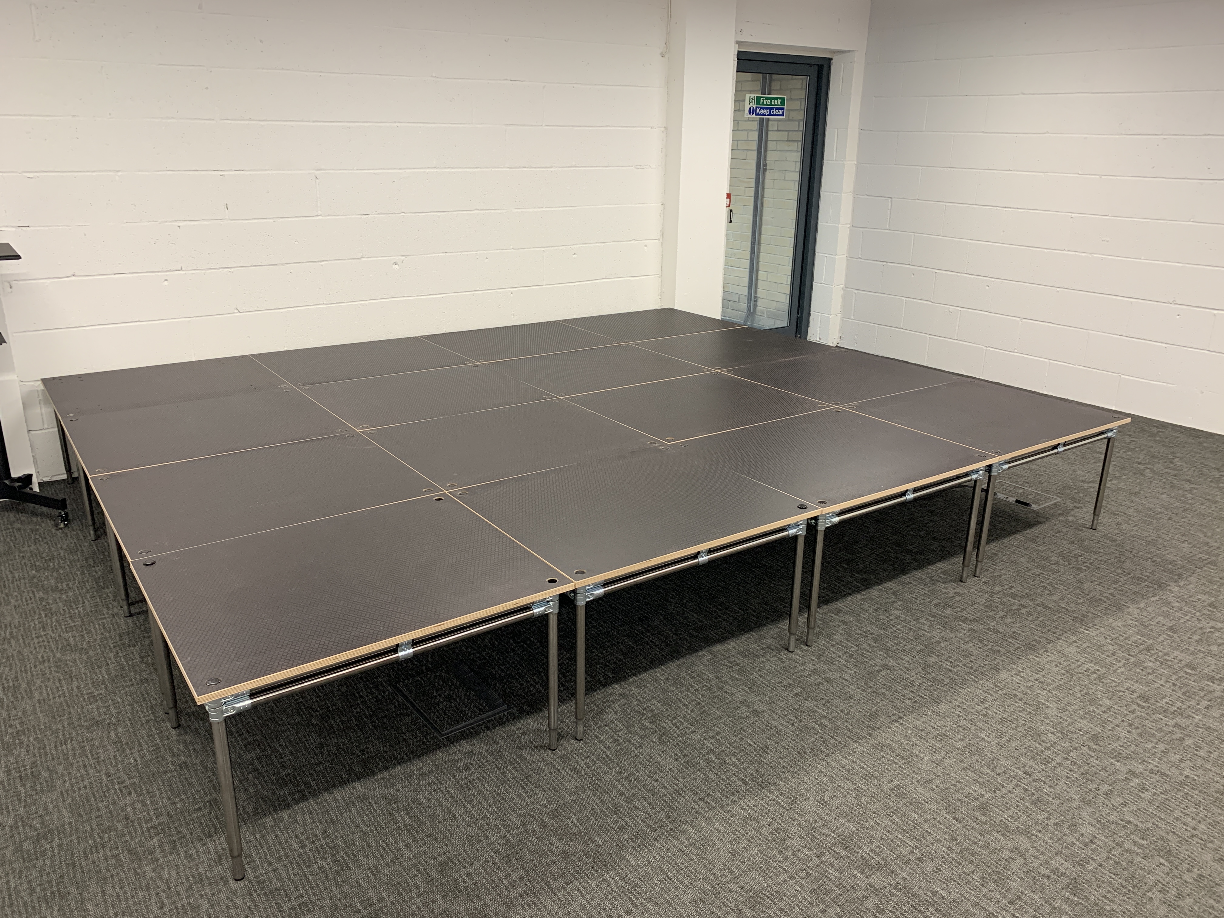Modular stage setup at Vandon Rooms, ideal for presentations and performances.