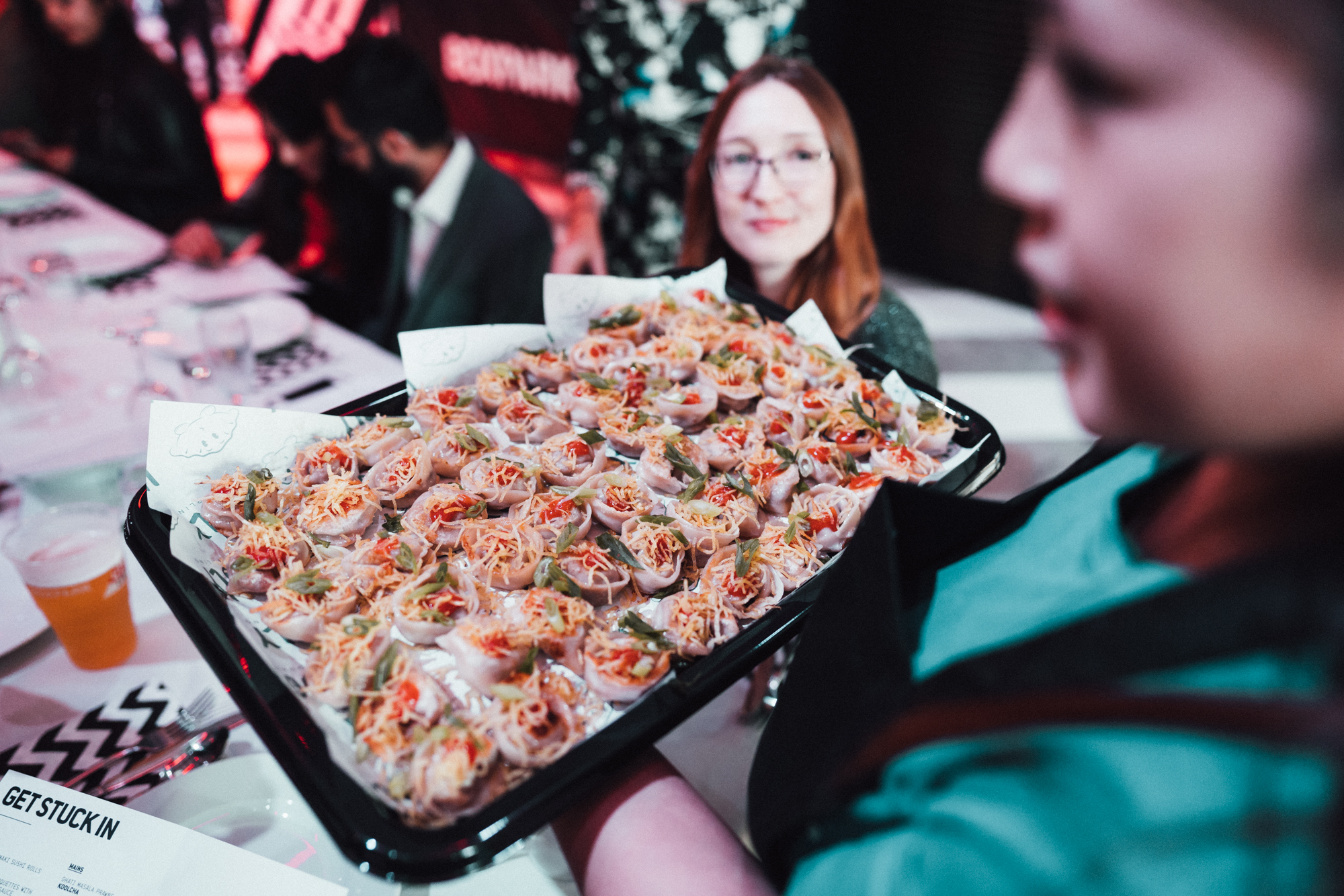 Vibrant Venue Takeover at Boxpark Wembley with fresh spring rolls for networking event.