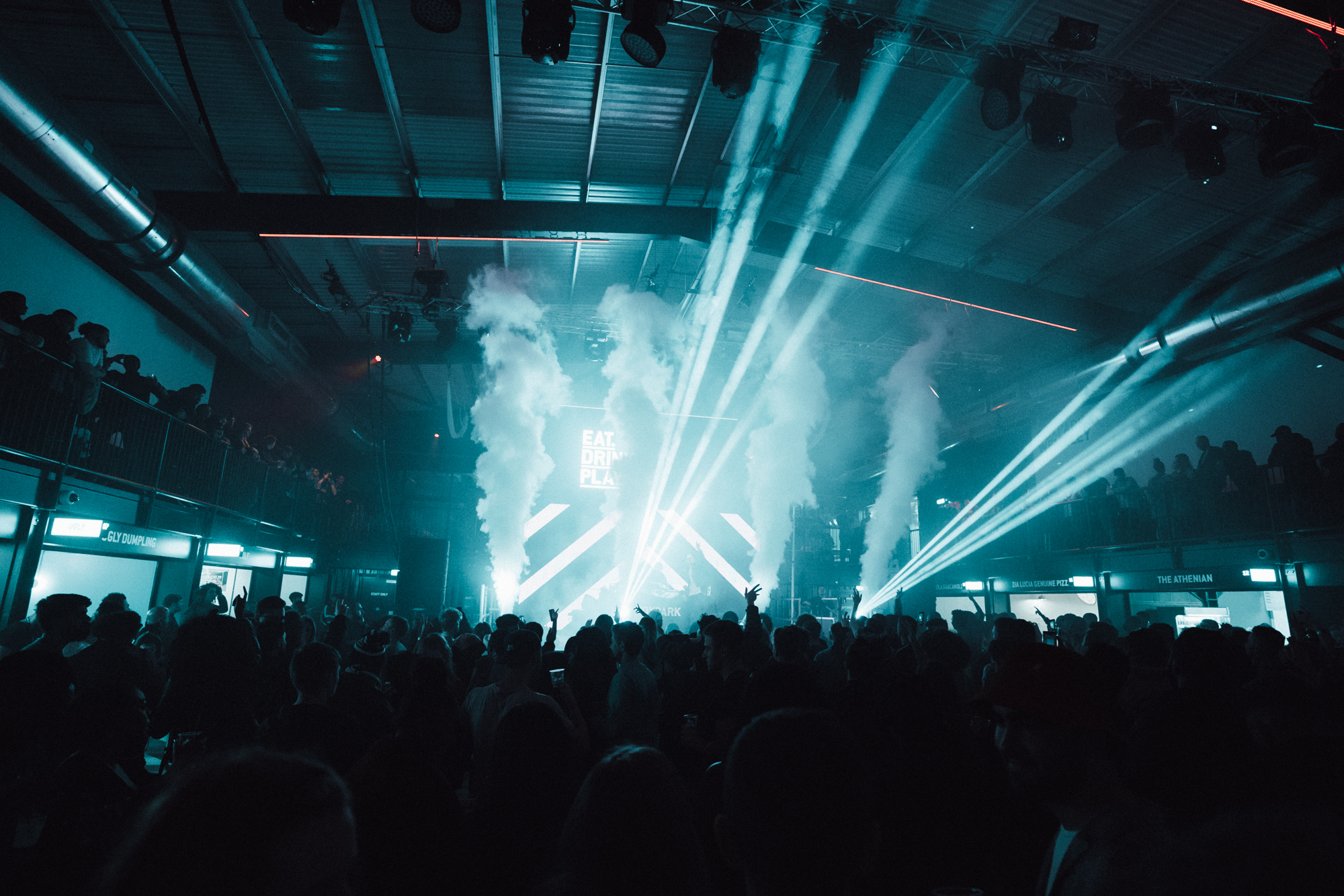 Vibrant Venue Takeover at Boxpark Wembley with energetic crowd and dynamic lighting.