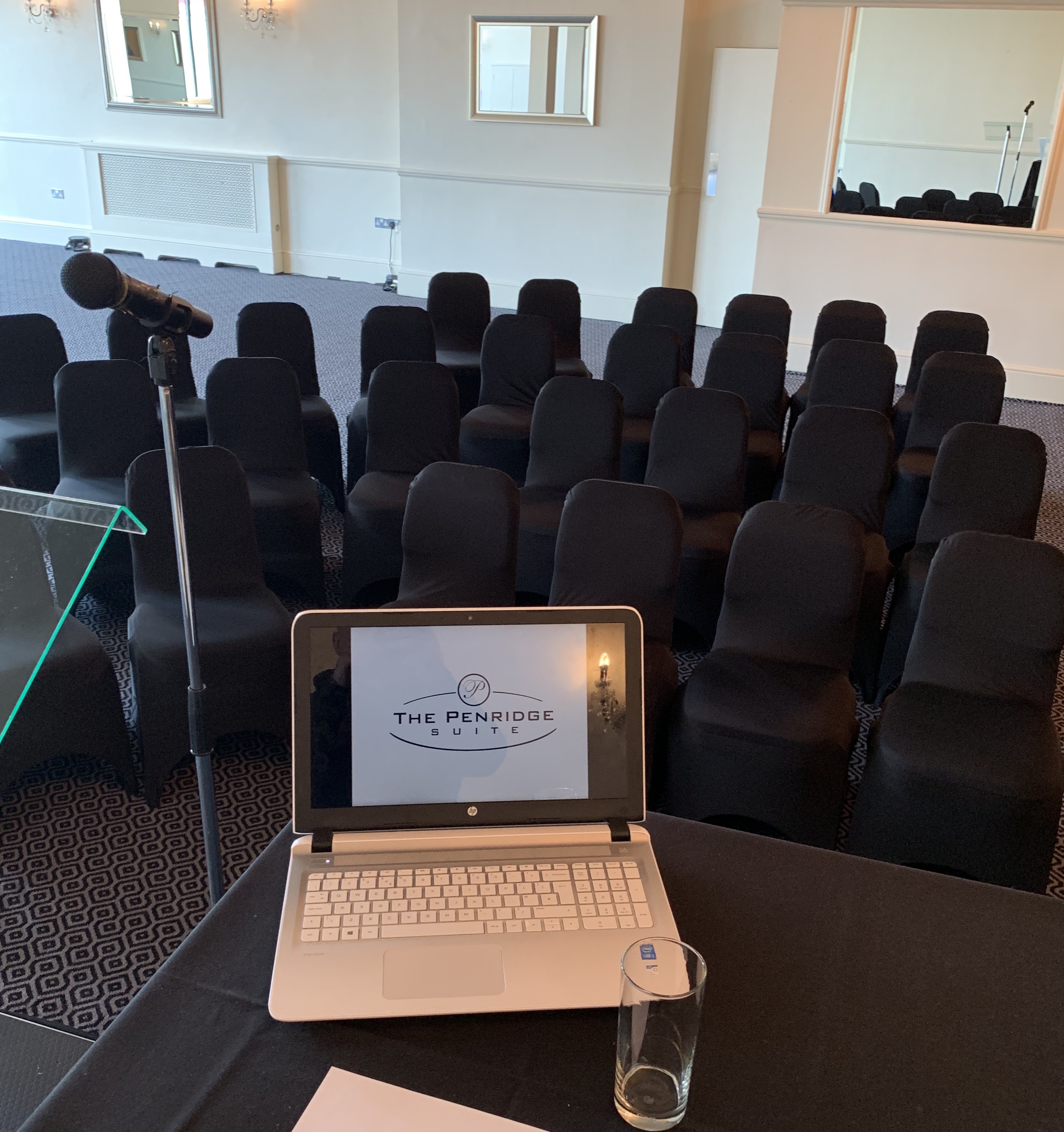 Wedding Hall Suite setup with podium and laptop, perfect for professional events.
