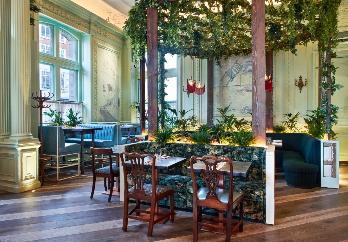 Elegant event space with lush greenery for intimate gatherings in Andaz London.