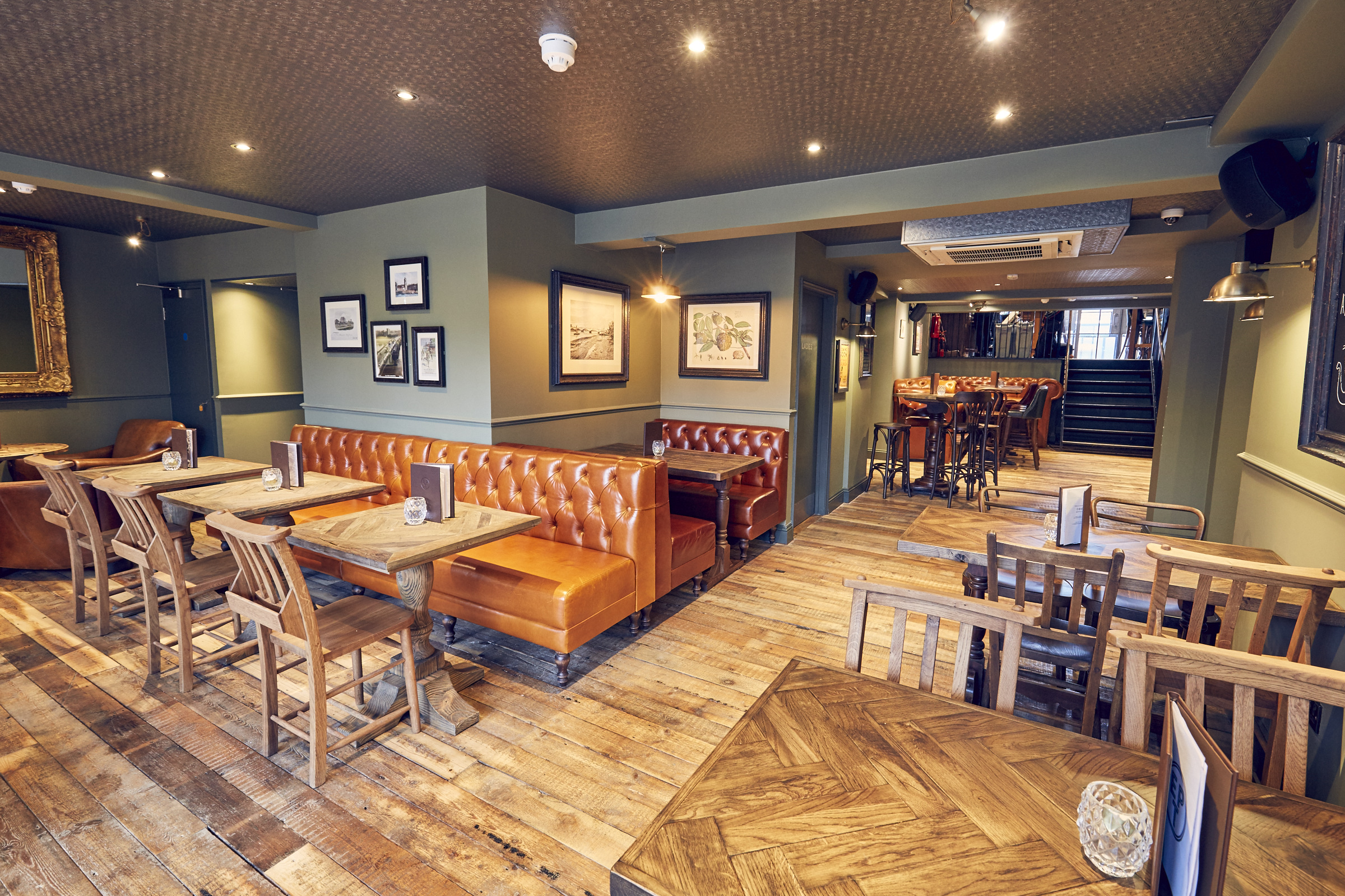 Versatile event space in East Putney Tavern with cozy seating for gatherings and meetings.