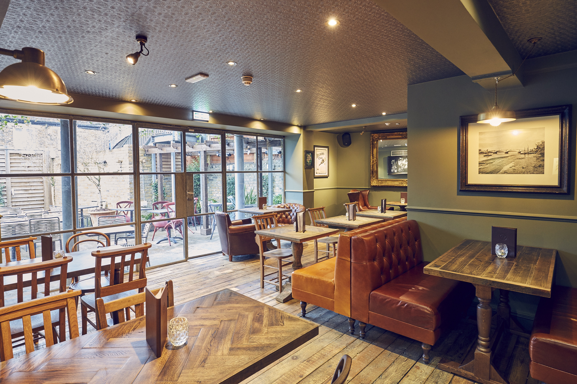 Cozy East Putney Tavern downstairs area with warm lighting for intimate events.