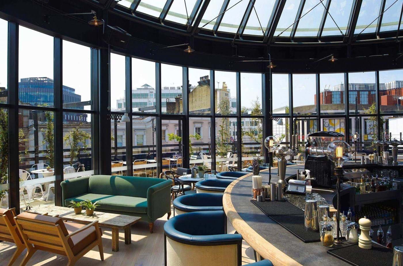 Modern event venue with panoramic windows, ideal for networking and receptions.