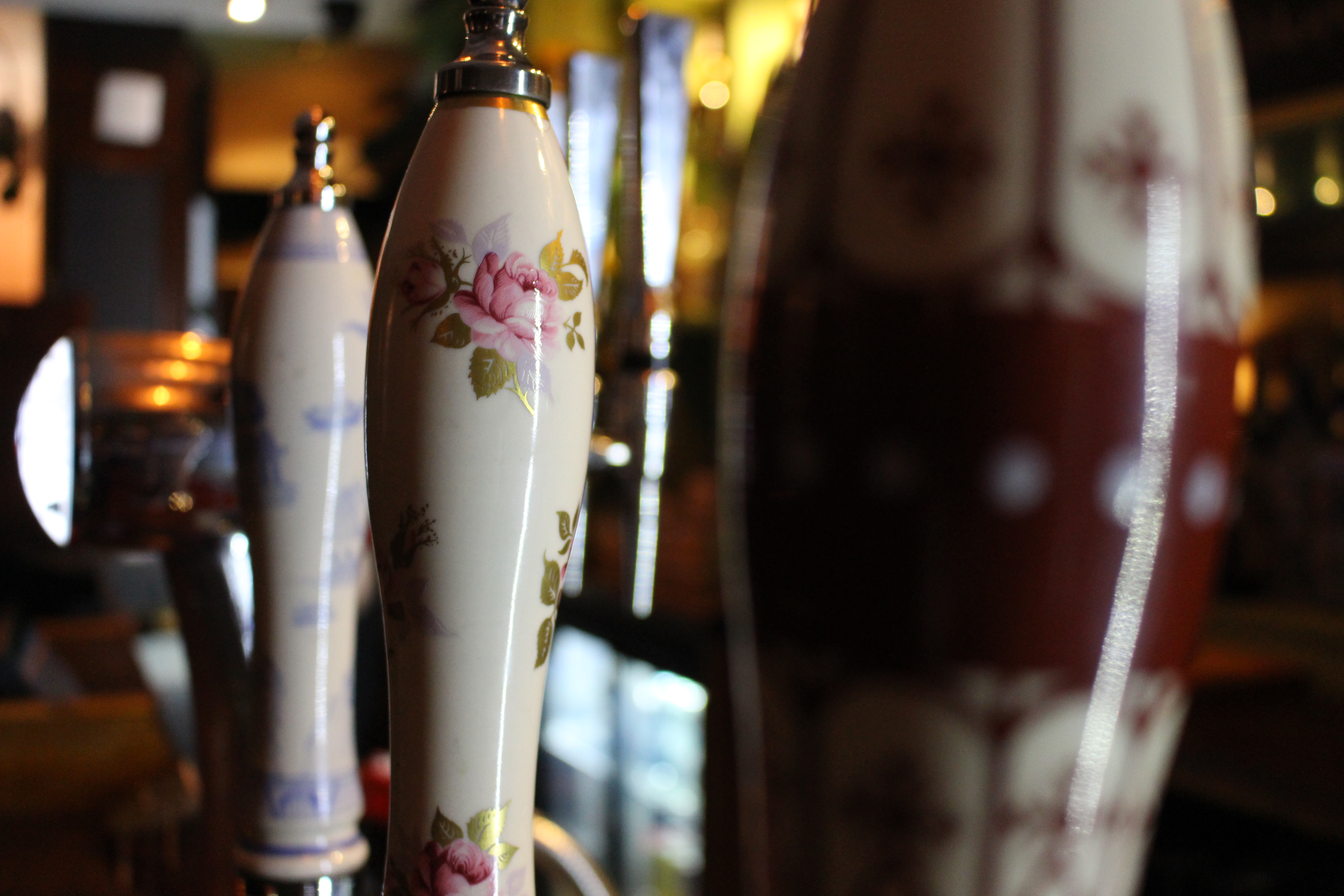 Ornate beer taps at The Bar and Garden, ideal for events and gatherings.