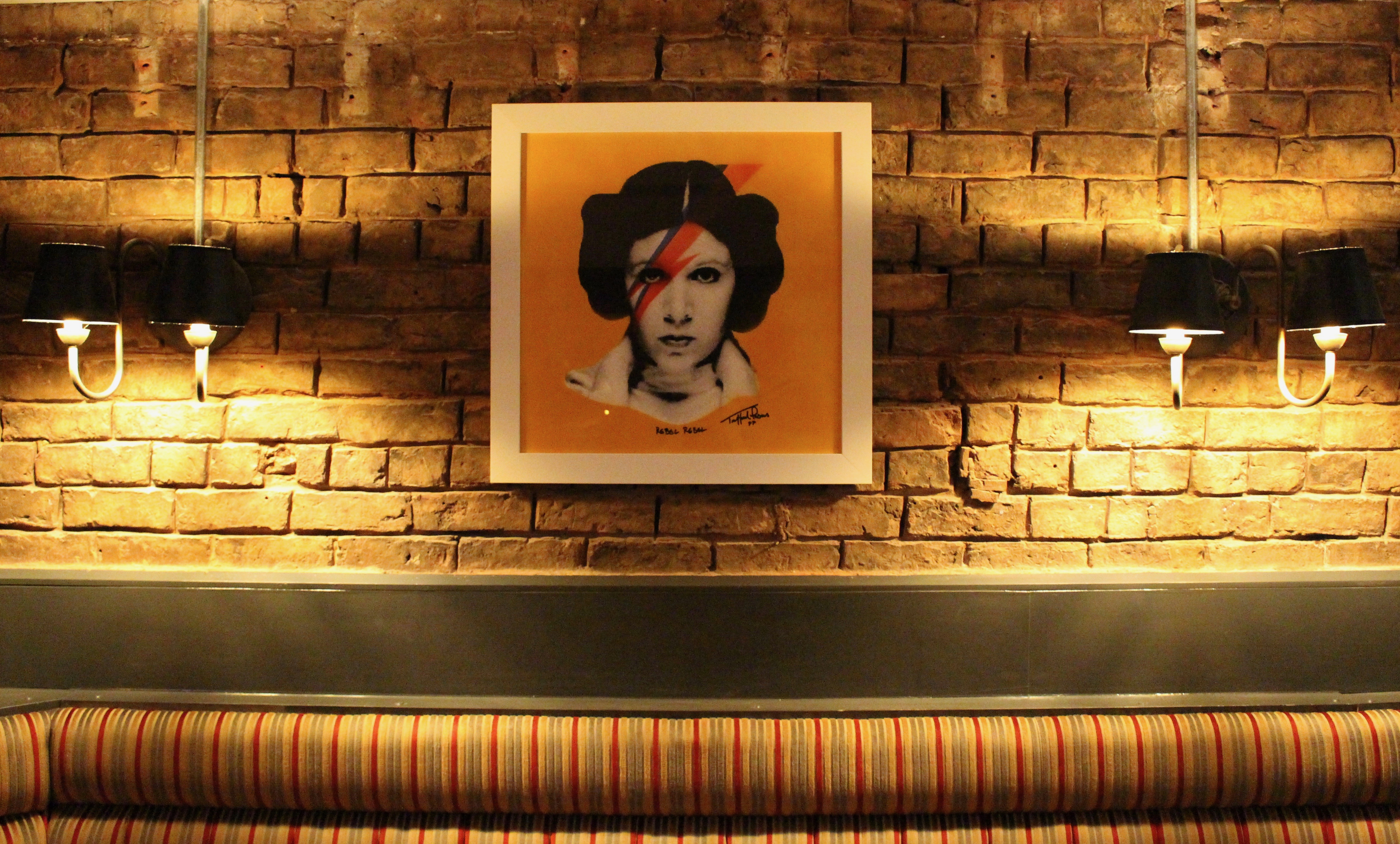 Stylish venue with pop culture art, perfect for networking events and gatherings.