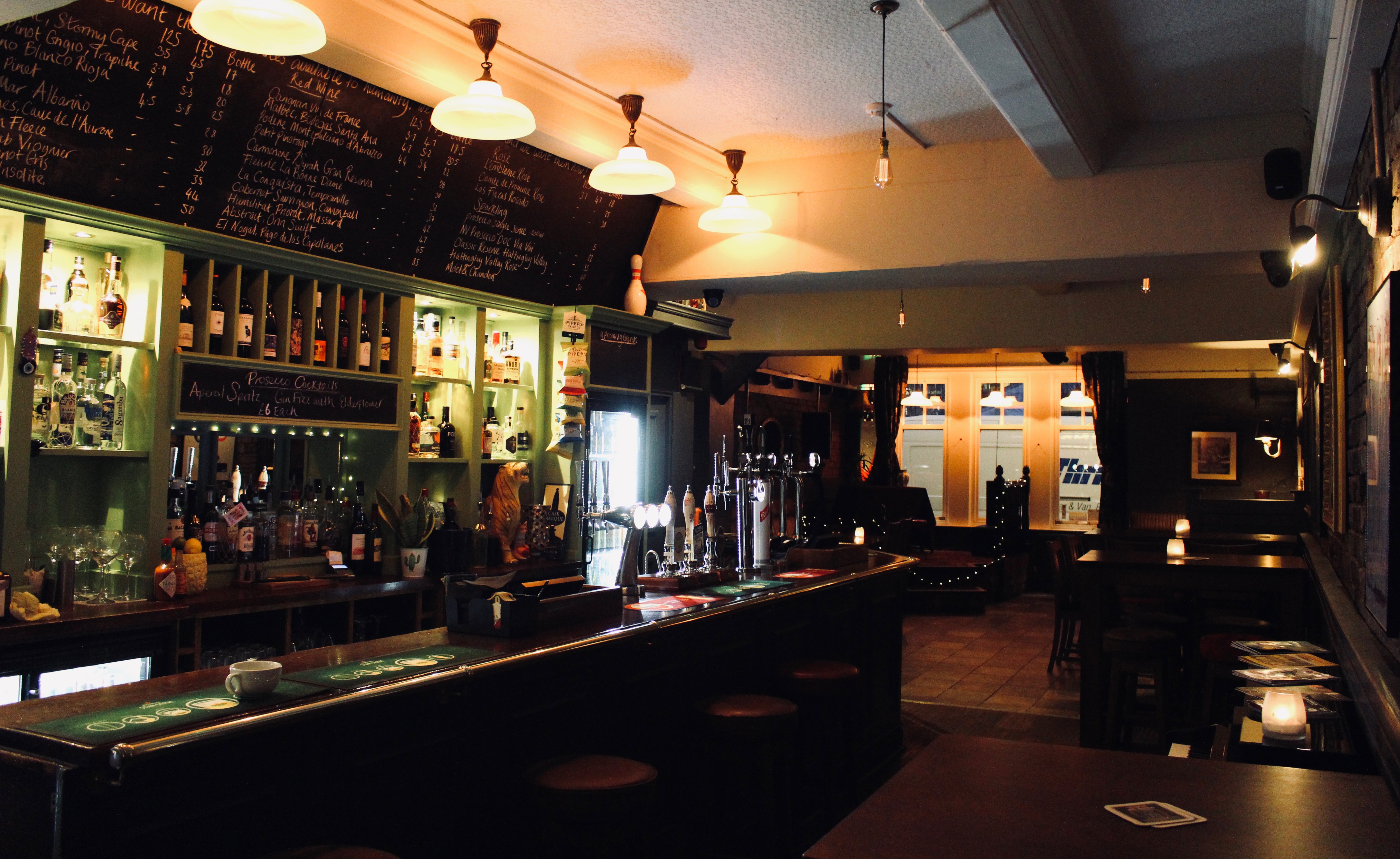 Cozy bar at The Rose and Monkey, perfect for networking events and informal meetings.