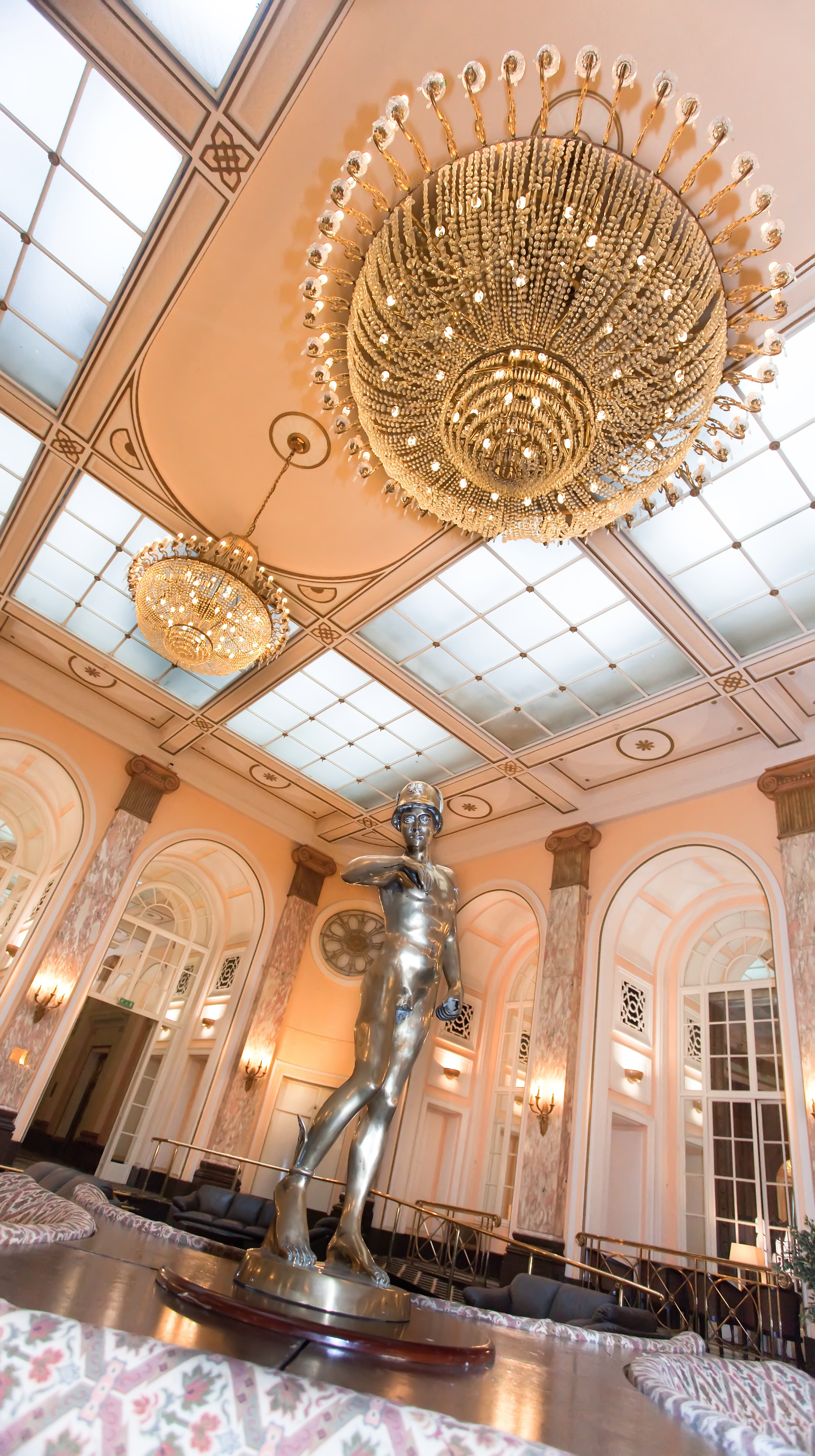 Elegant Grand Lounge at The Adelphi Hotel with chandelier, ideal for upscale events.