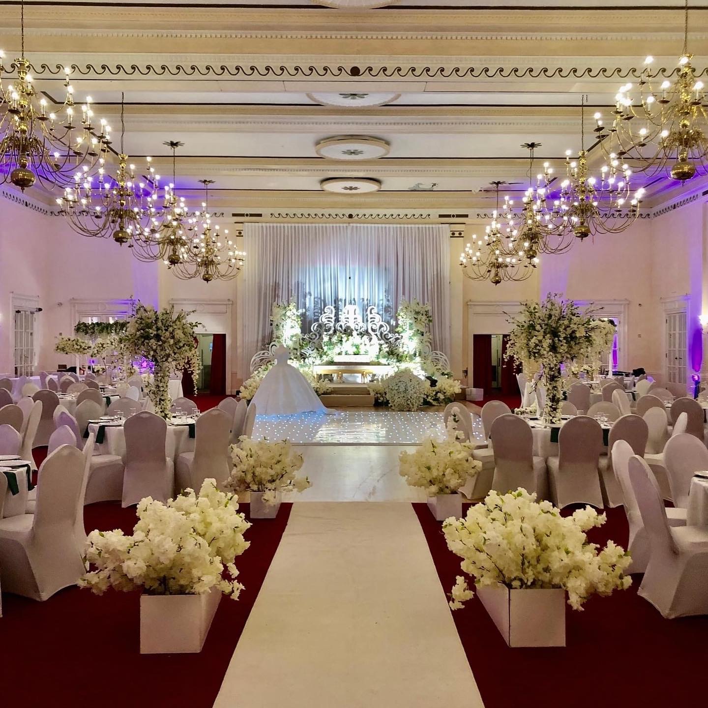 Elegant wedding venue in The Adelphi Hotel's Banqueting Hall with floral centerpieces.