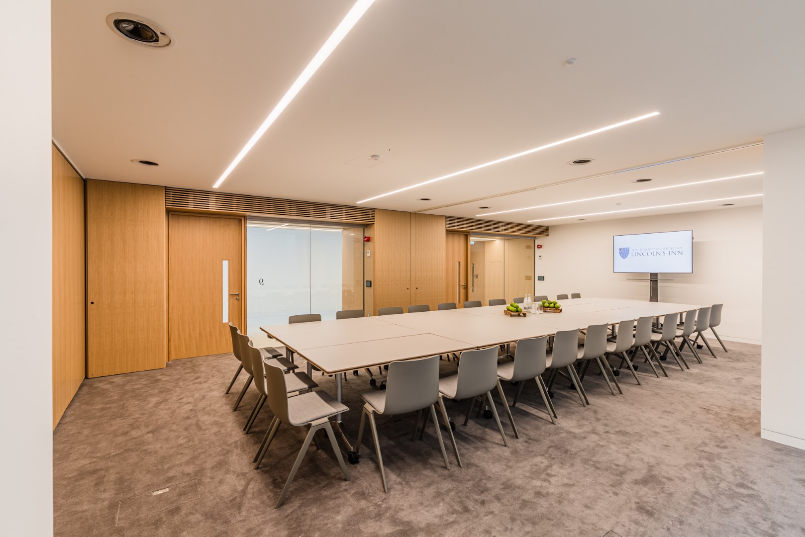 Modern conference room at Ashworth Centre, featuring a large table for meetings and events.