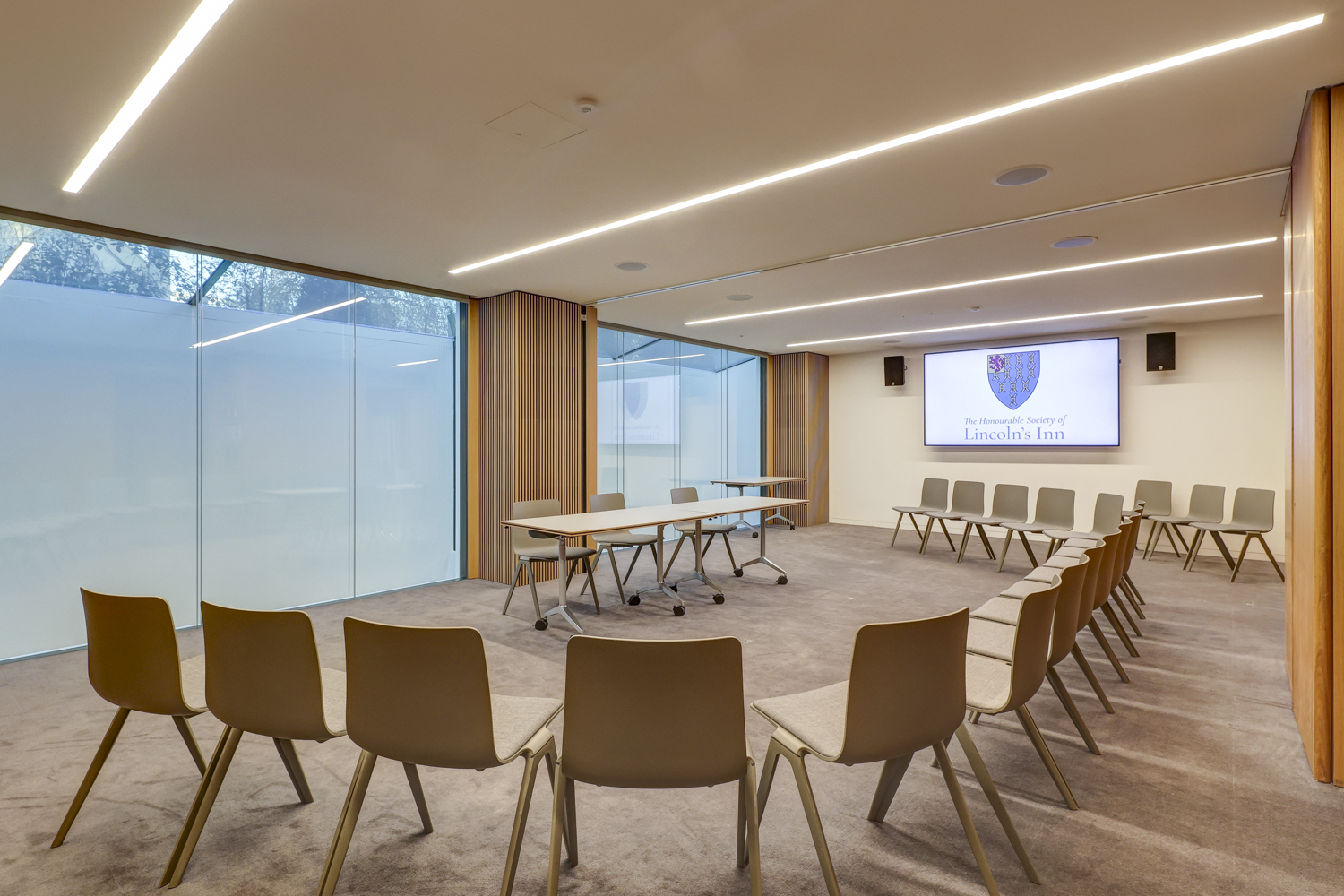 Modern meeting room at Ashworth Centre, featuring circular seating for workshops and presentations.
