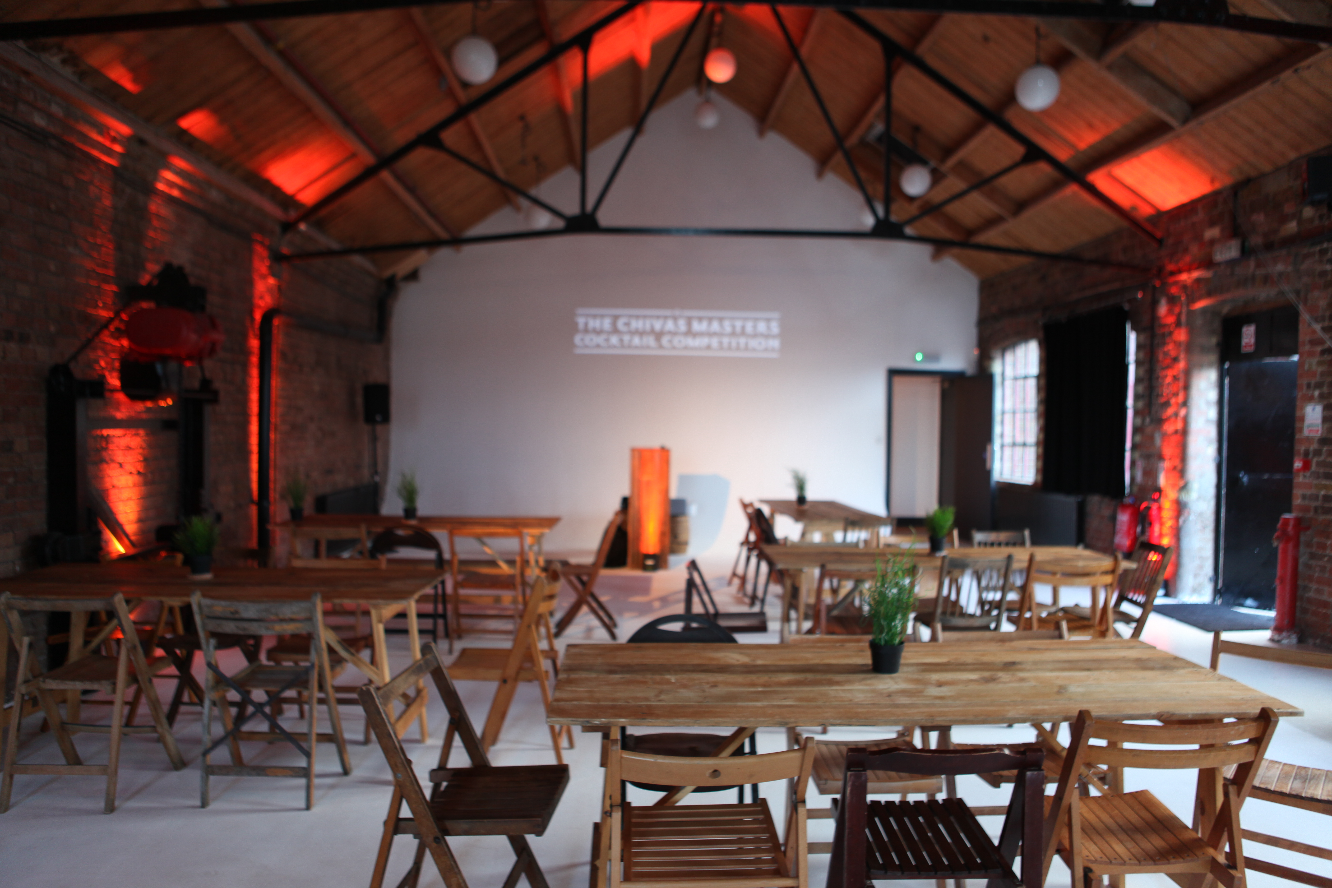 Versatile Loft Studios event space with rustic charm, ideal for workshops and networking.
