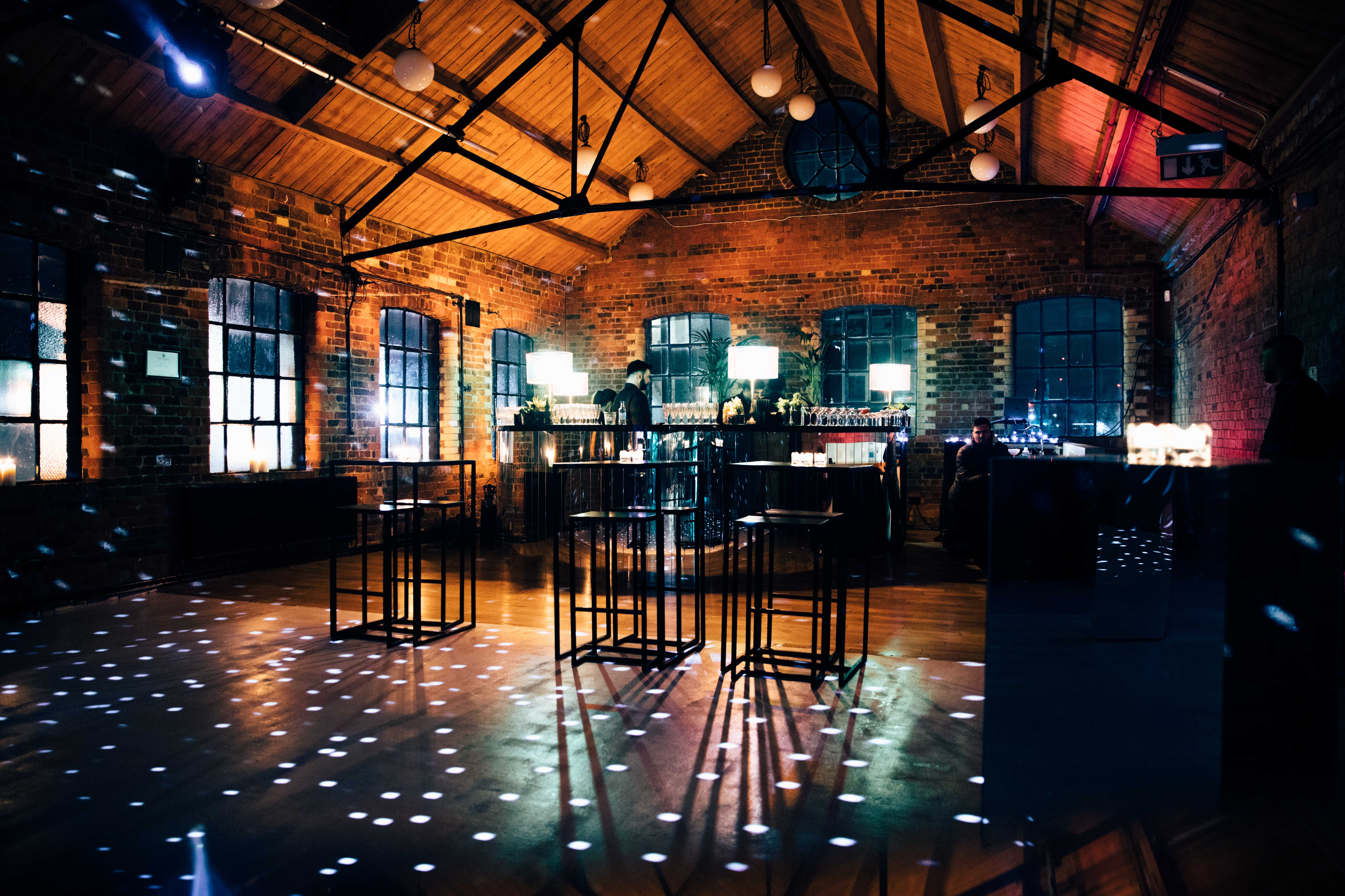 Stylish Loft Studios event space with exposed brick walls, ideal for networking and gatherings.