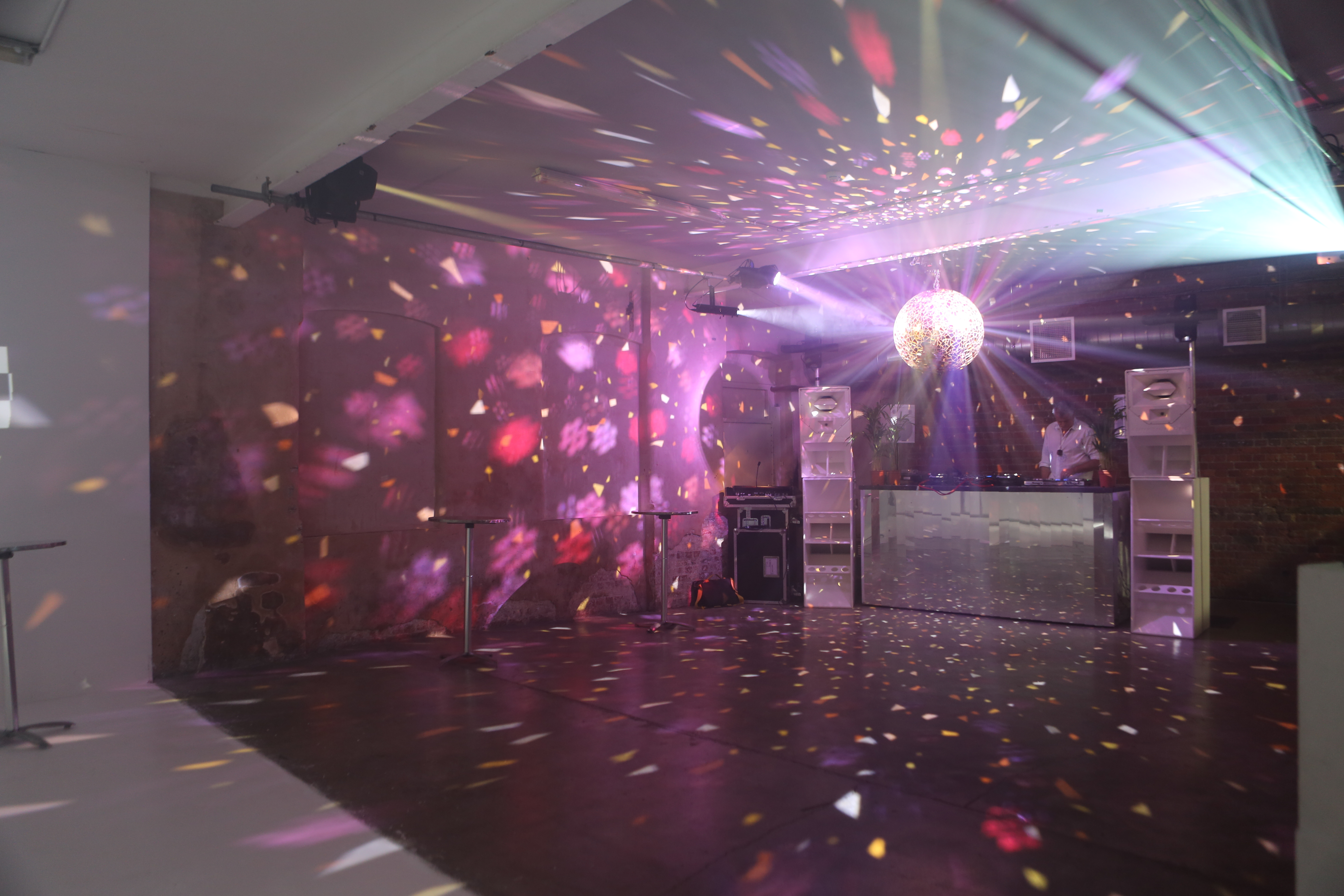 Vibrant Studio 5 event space with disco ball, ideal for parties and celebrations.