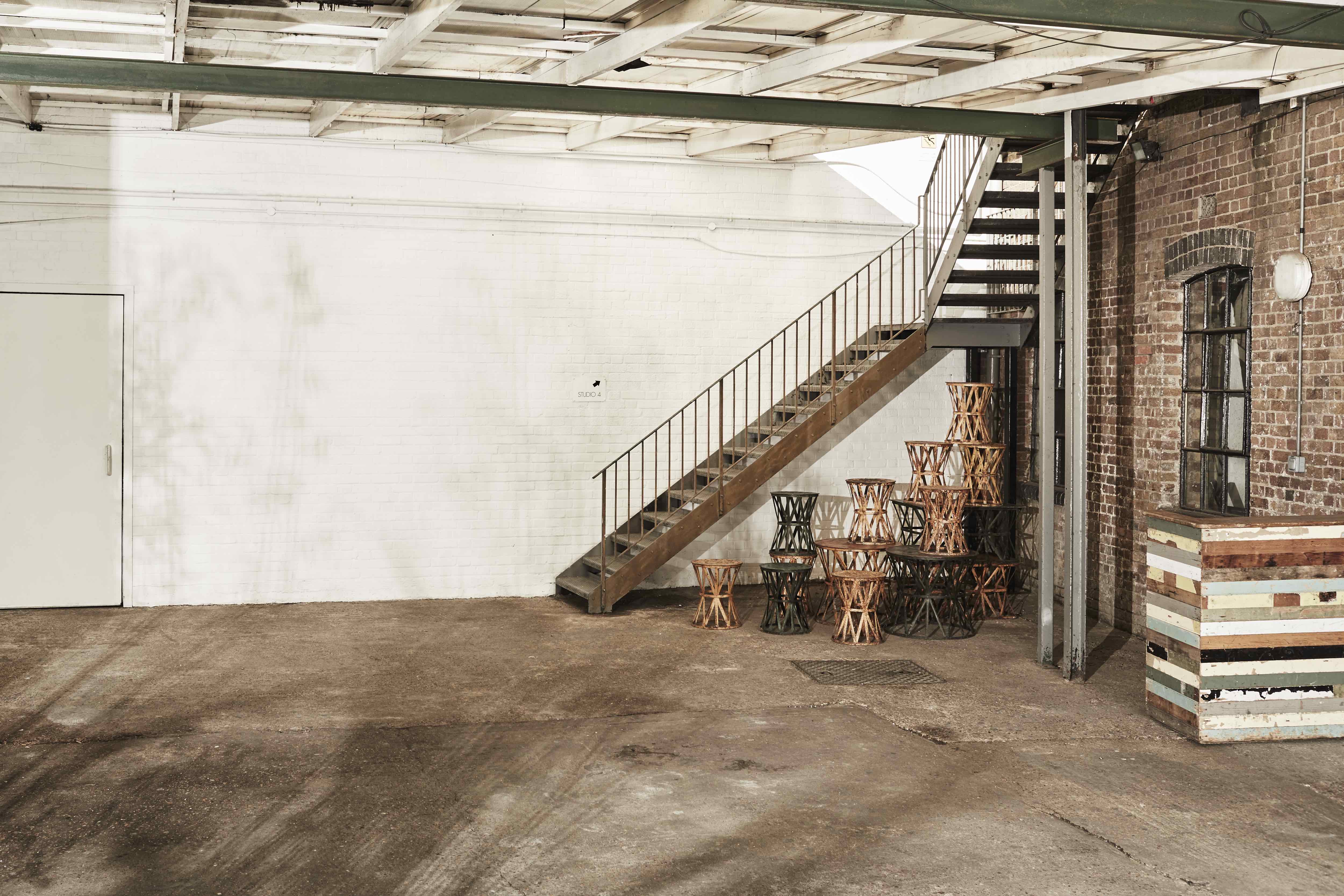 Daylight Courtyard at Loft Studios: spacious industrial event space with unique staircase.