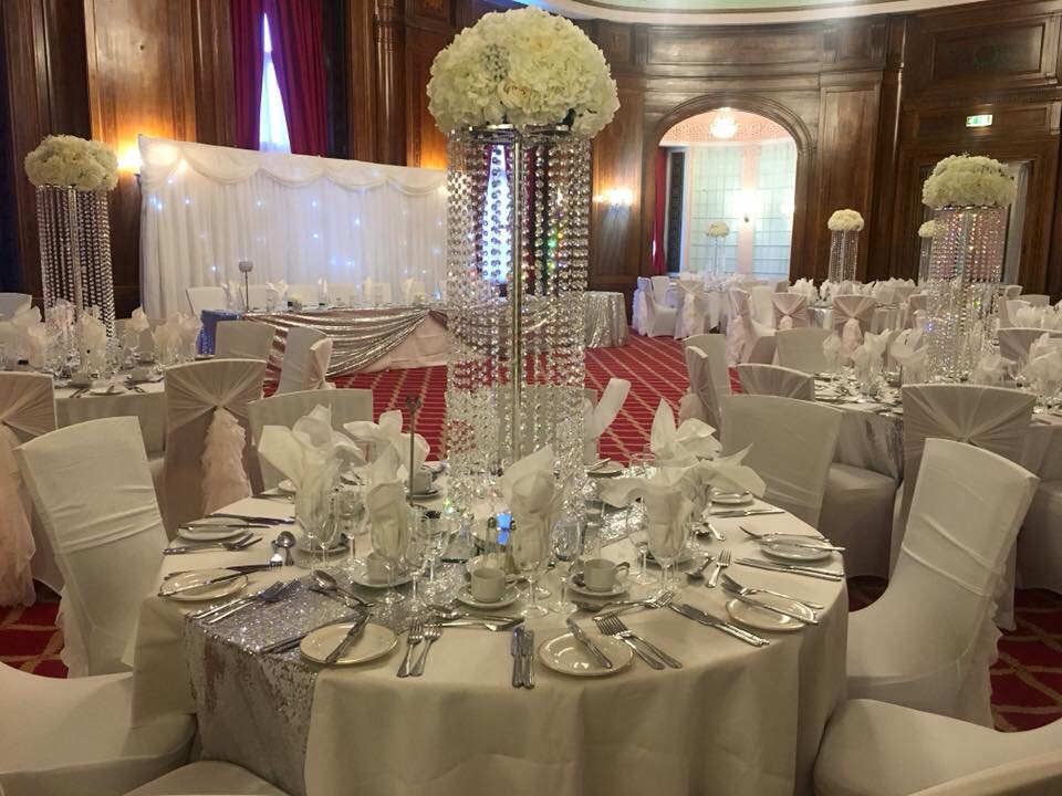 Elegant Sefton Suite banquet hall with floral centerpieces, perfect for weddings and events.