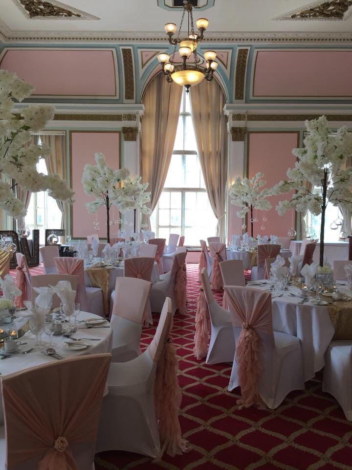 Crosby Suite at The Adelphi Hotel, elegant wedding venue with floral decor and natural light.