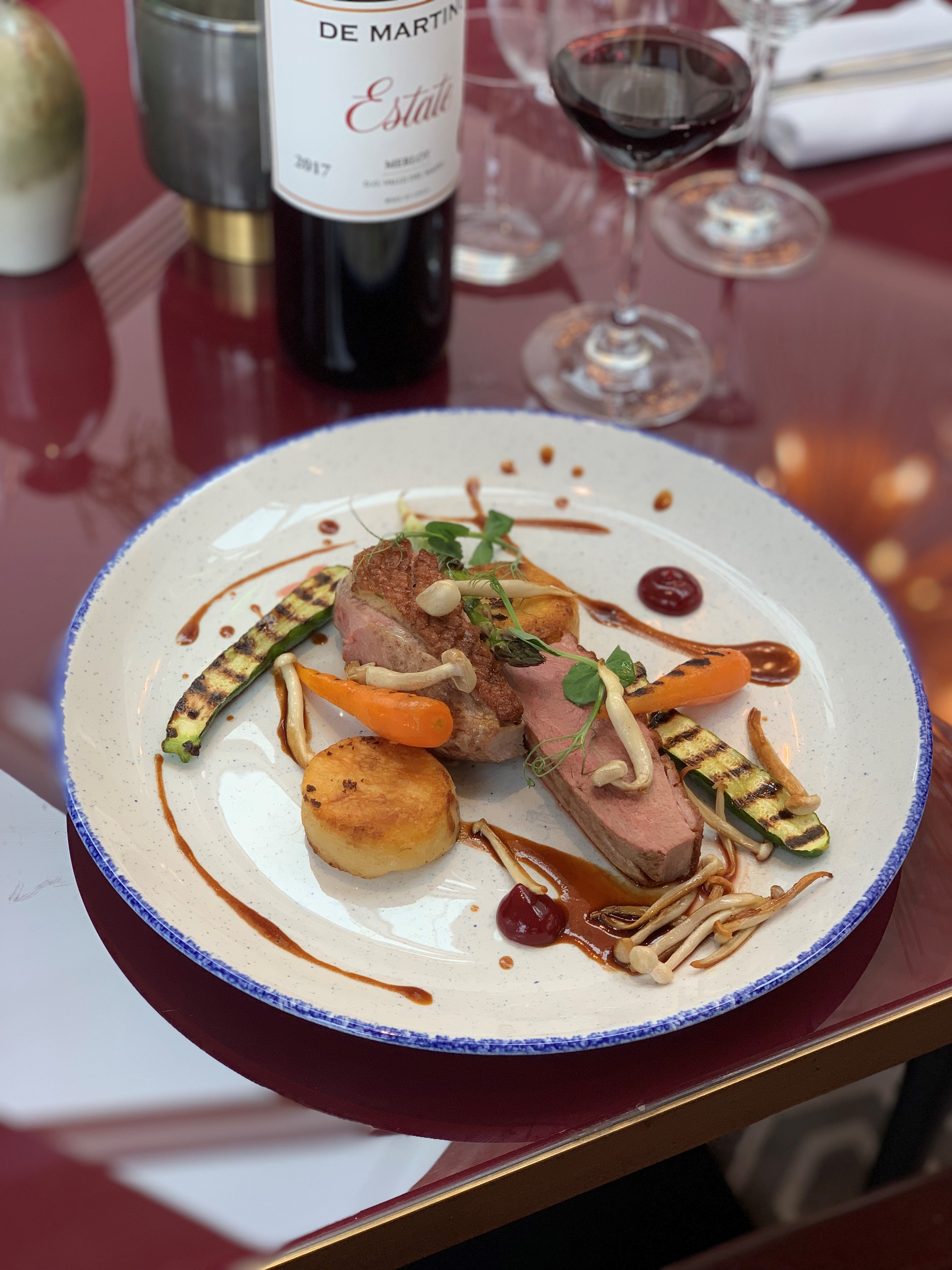 Gourmet meat dish with vibrant vegetables at Aldwyn's, perfect for upscale events.