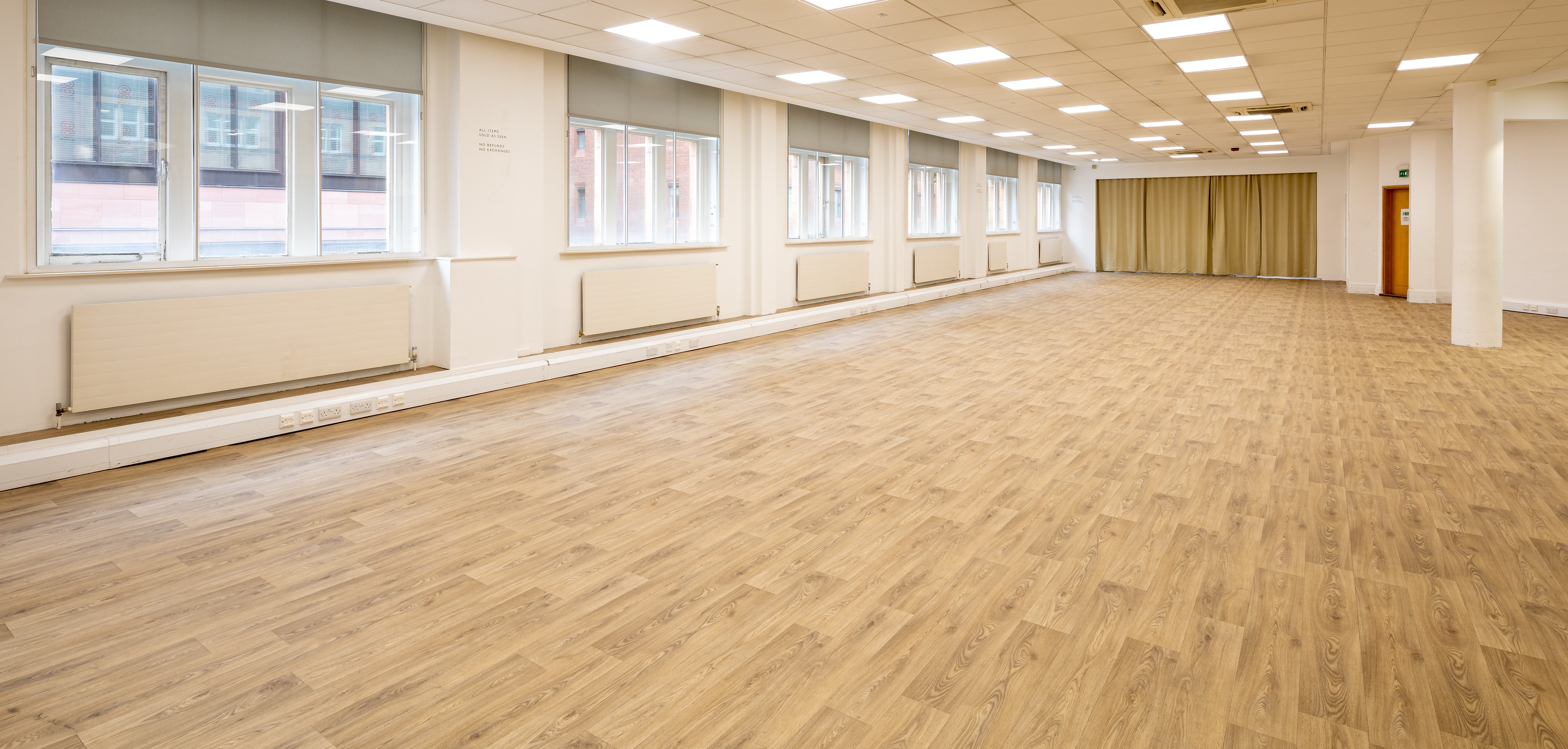 Spacious event venue in The Music Room Mayfair with large windows, ideal for corporate meetings.