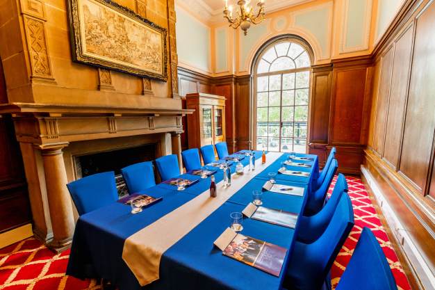 Meeting room at The Adelphi Hotel with blue decor, ideal for corporate events.