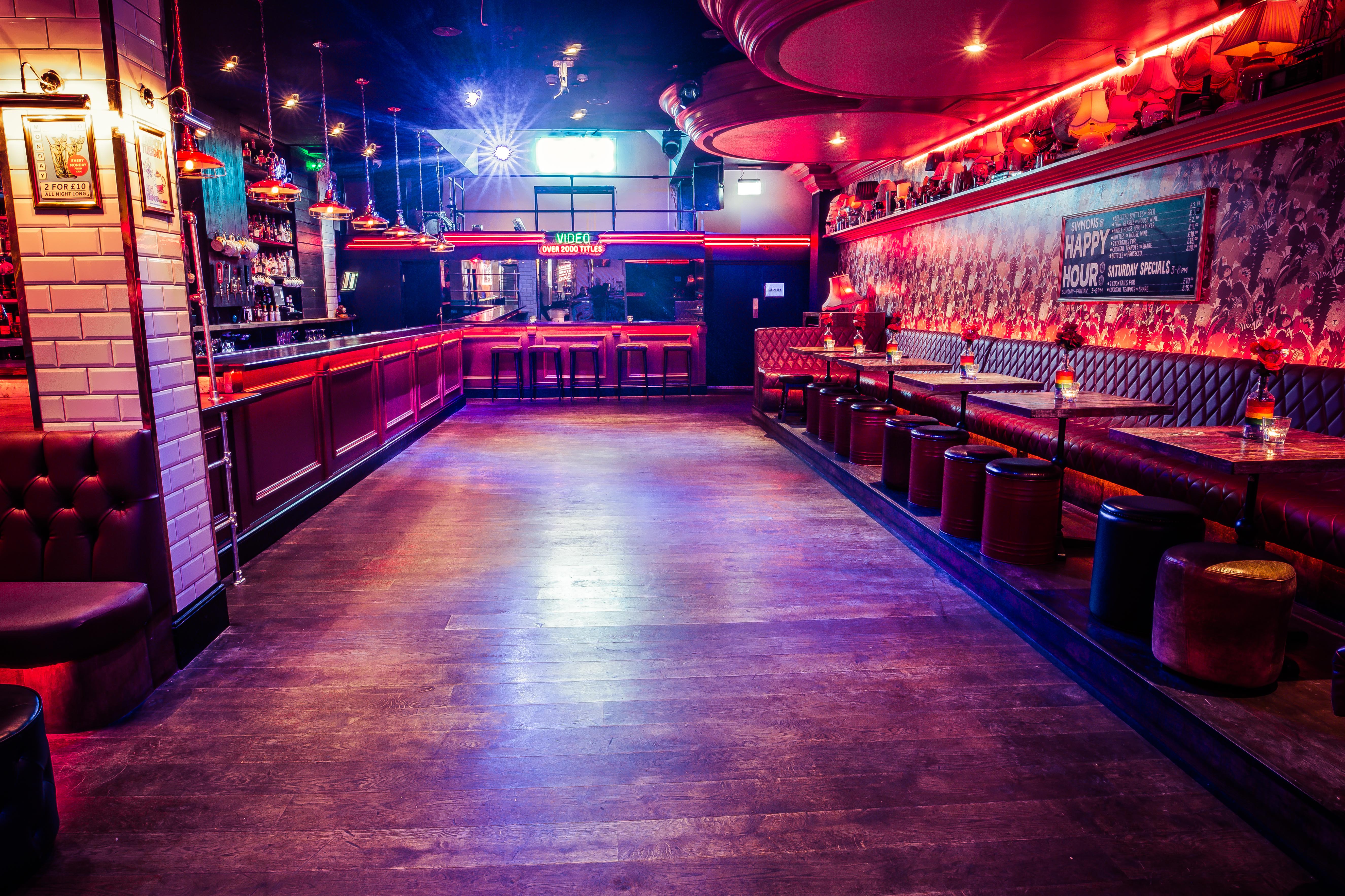 Vibrant semi-private event space with stylish bar for social gatherings and meetings.