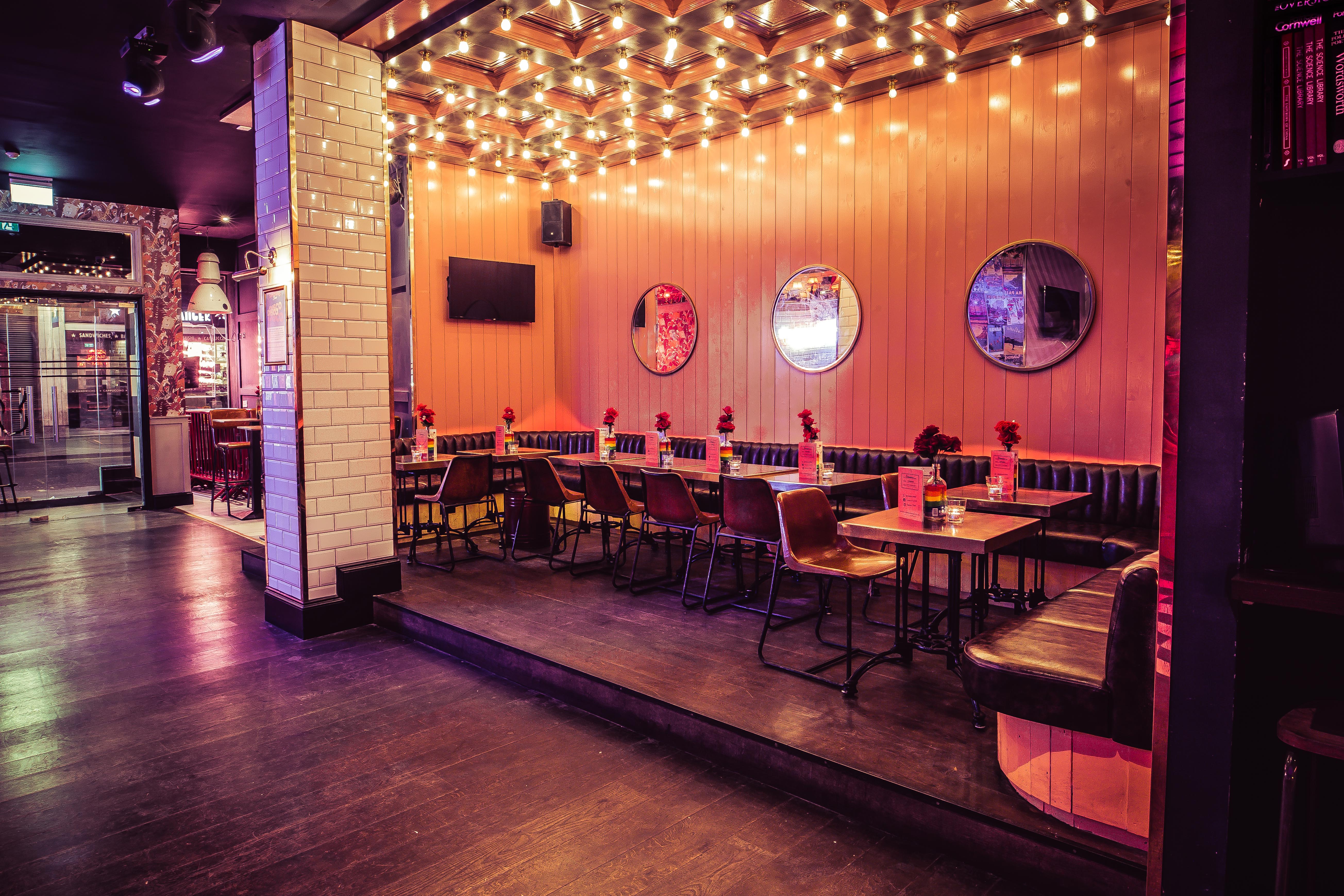 Stylish event space with warm lighting, ideal for gatherings and networking in Oxford Street.