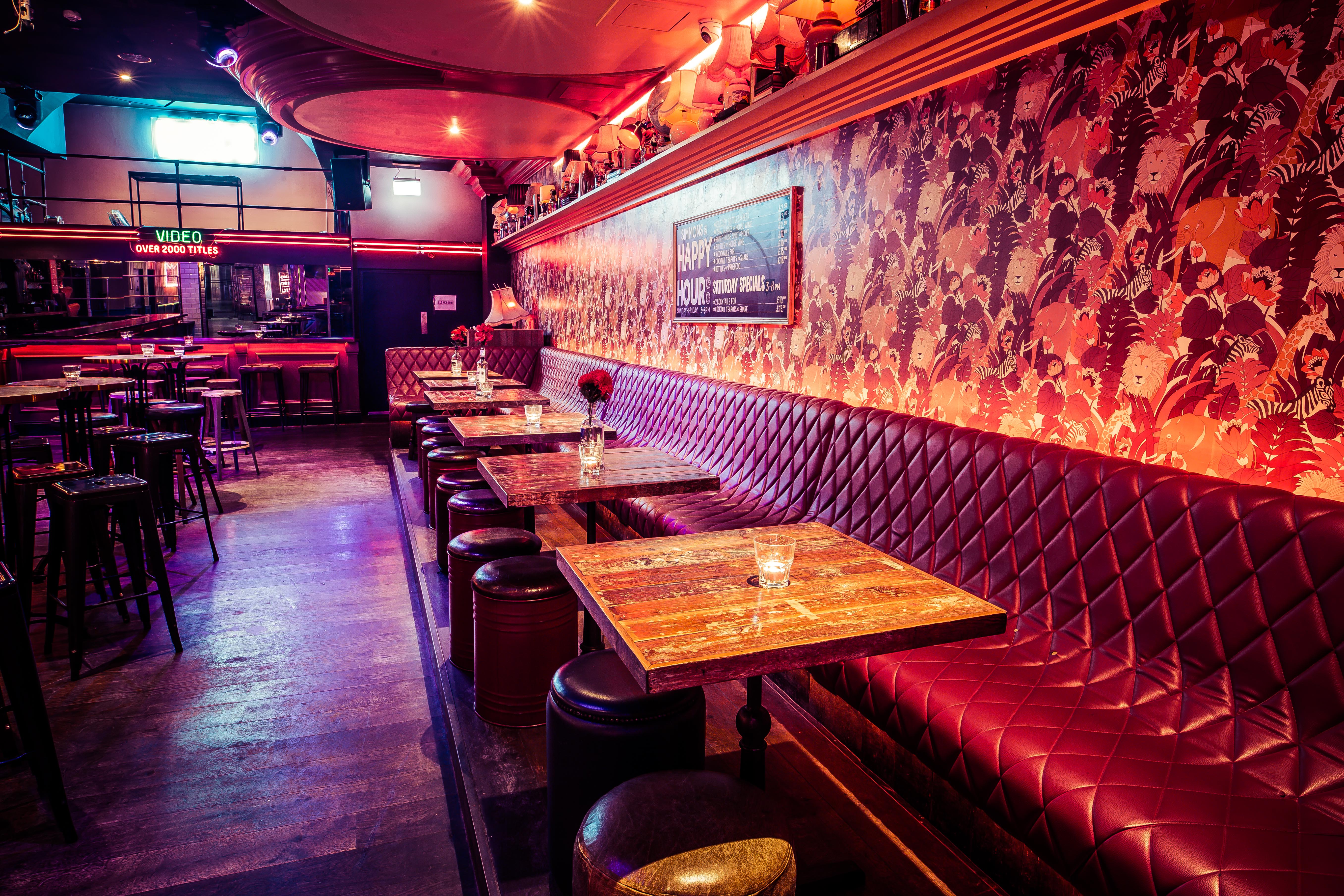 Stylish venue with plush red seating, perfect for social events and gatherings.