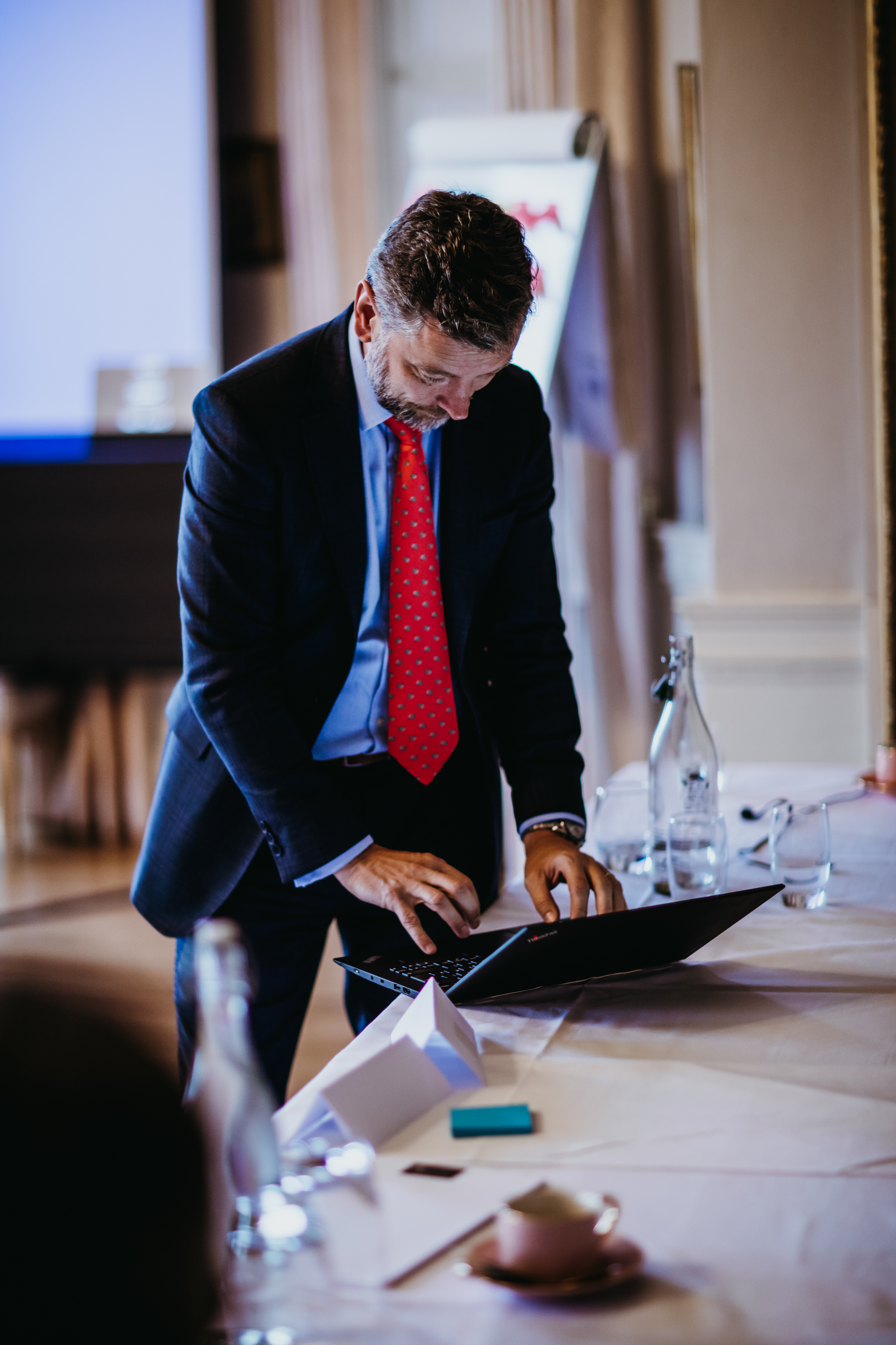 Professional preparing for a meeting at Norwood Park Country House venue.