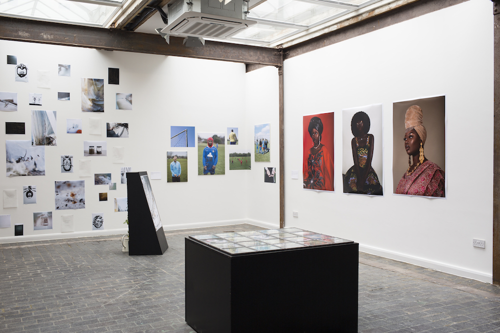 Contemporary art gallery with framed photos, ideal for exhibitions and networking events.