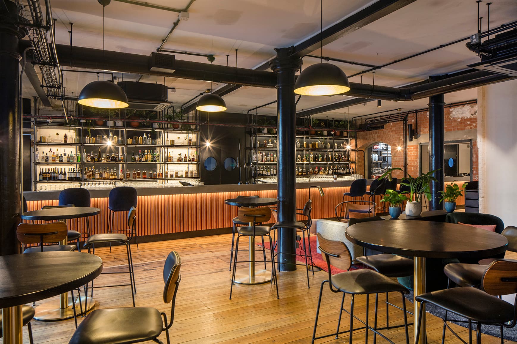Industrial-chic bar and garden venue for corporate cocktail networking events.