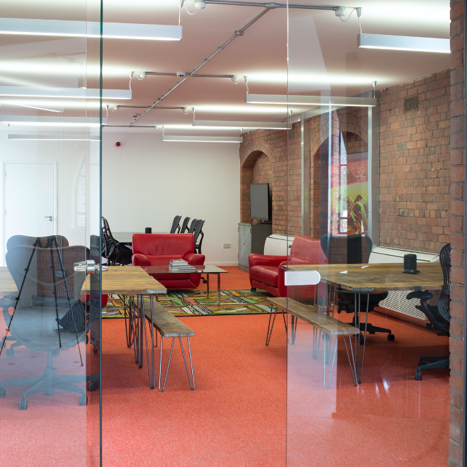 Modern meeting space in Iron House with vibrant colors for collaborative events.