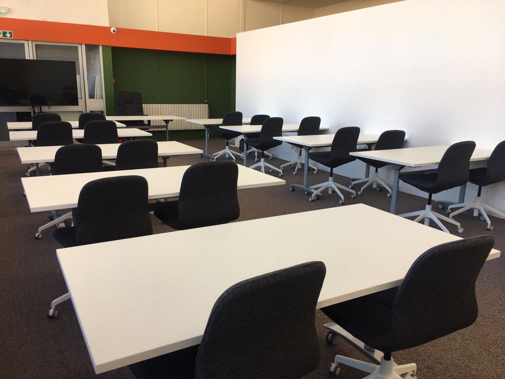 Conference Hall in Whitechapel Hub, organized meeting space for workshops and training.