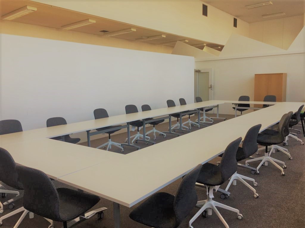 Conference Hall in Whitechapel Hub with U-shaped table for workshops and meetings.