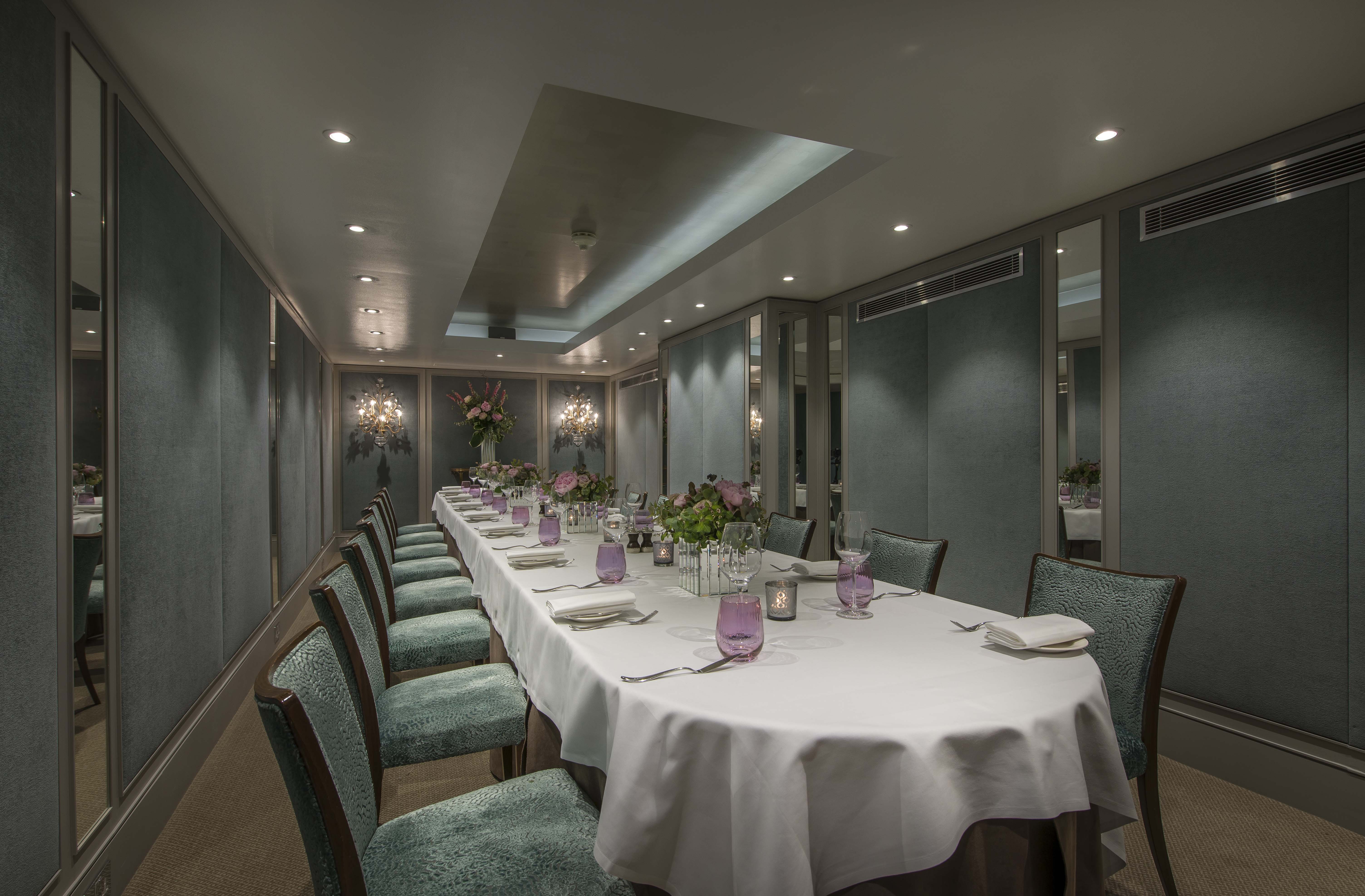 Cadogan Suite meeting space with elegant table, ideal for exclusive events and gatherings.