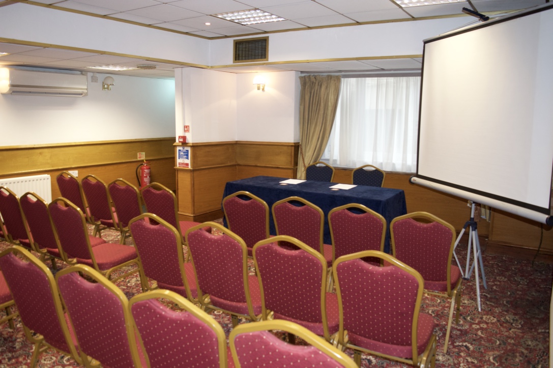Private dining room with burgundy chairs, perfect for meetings and workshops.