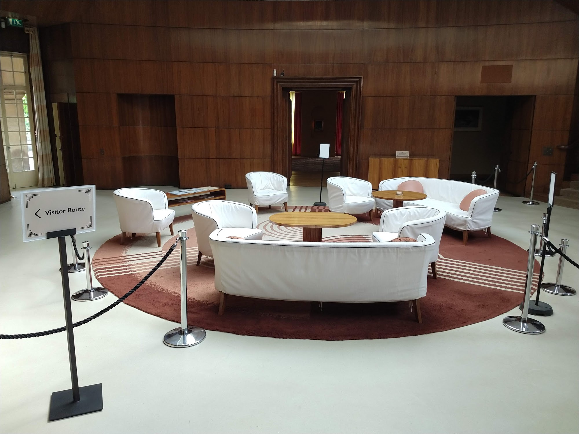 Art Deco Mansion VIP networking lounge with wood-paneled walls, ideal for corporate event hosting.