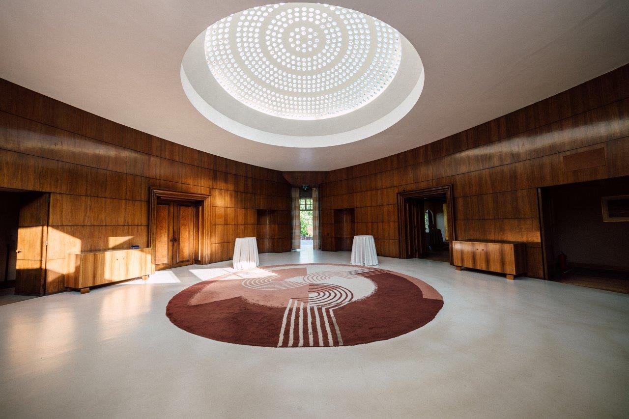 Art Deco Mansion circular event space with oculus for networking receptions and VIP welcome areas.