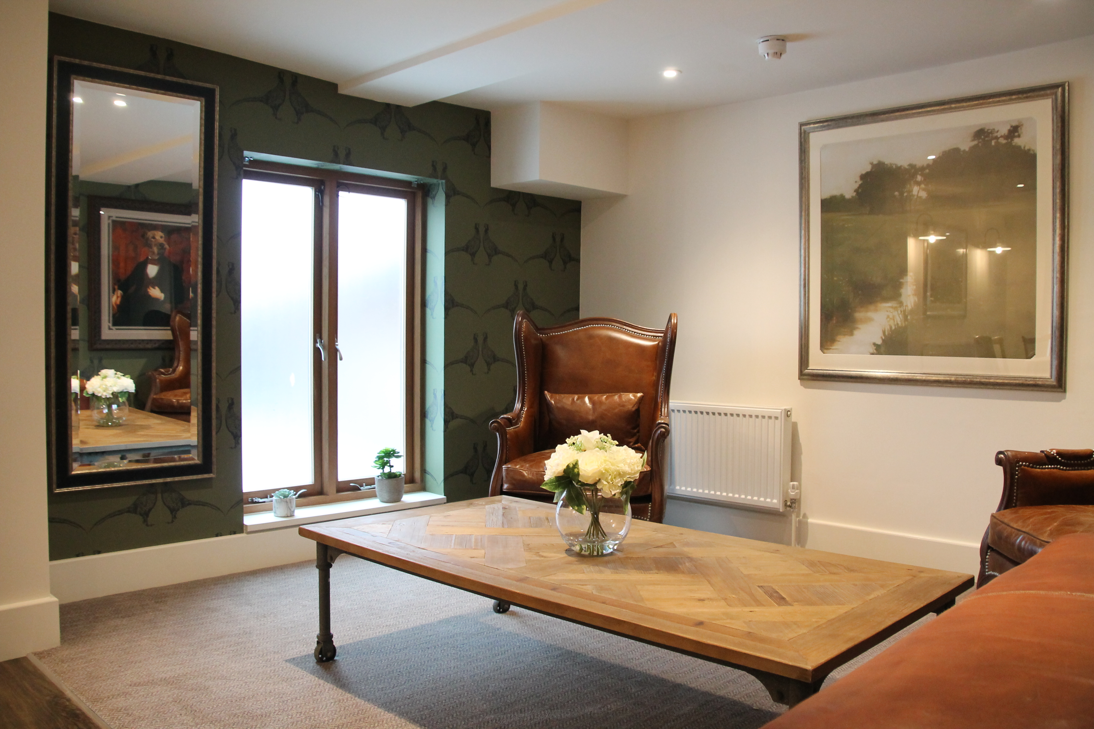 Stylish meeting space in Mythe Barn with elegant furnishings for intimate gatherings.