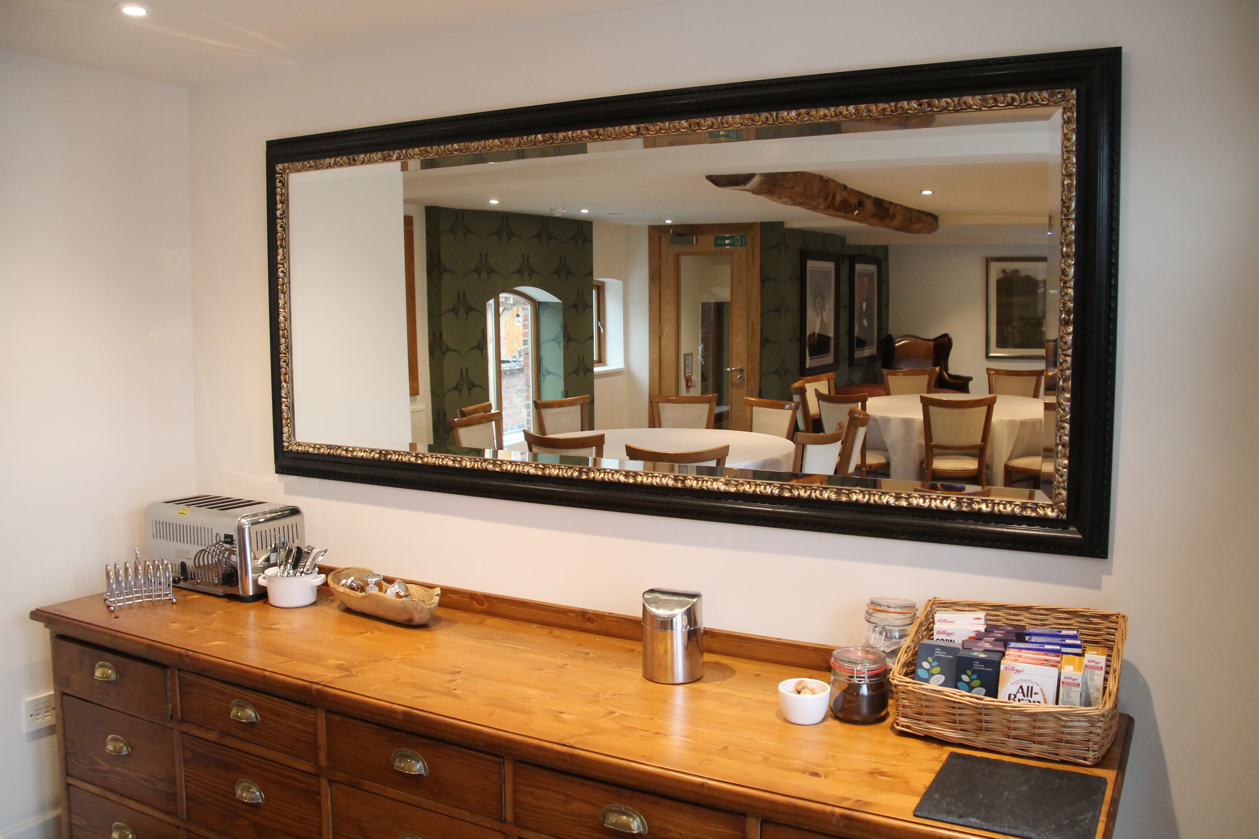 Elegant meeting space in Mythe Barn with polished sideboard, ideal for networking events.