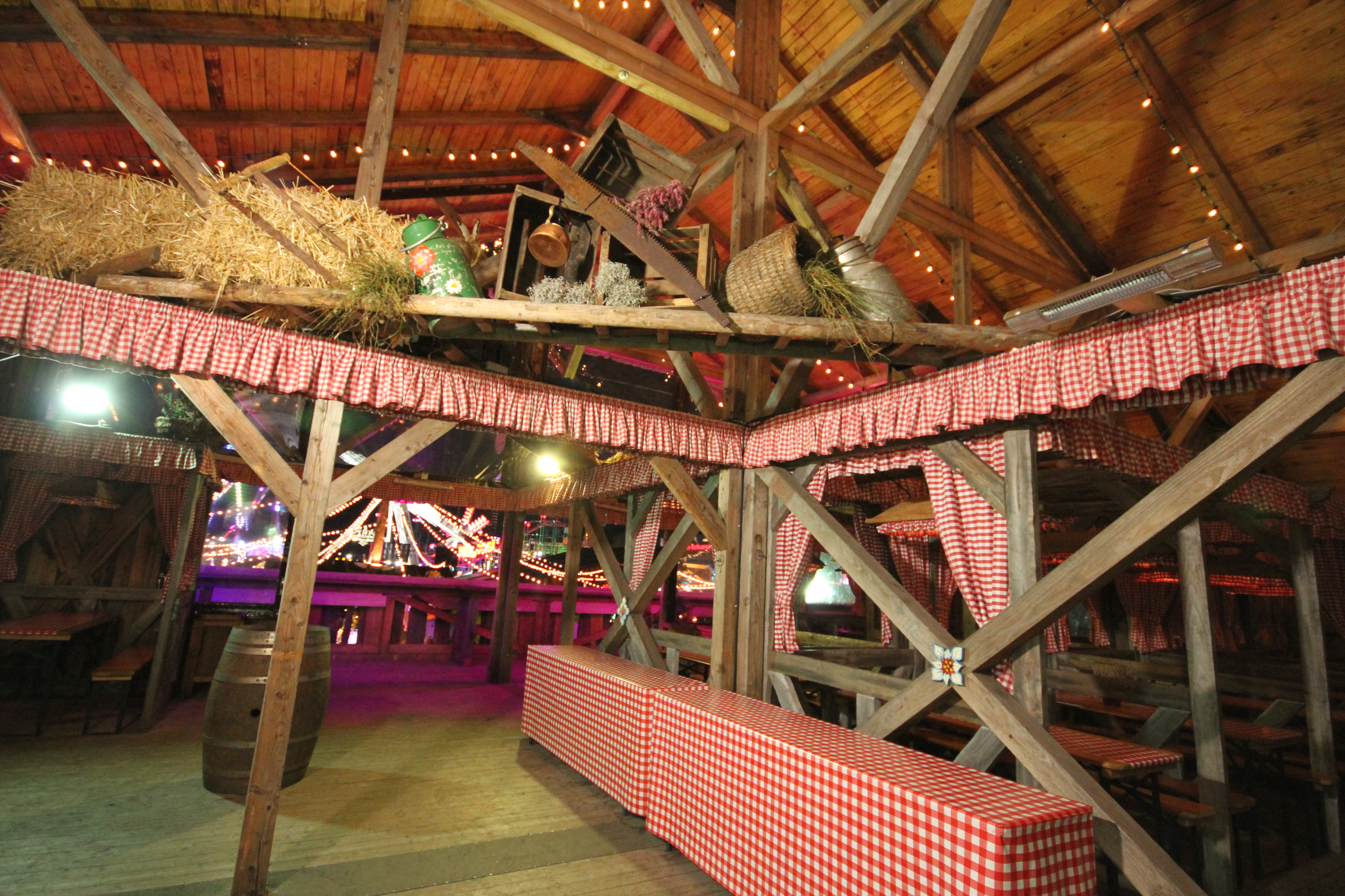 Rustic event space at Cafe Bavaria with wooden beams, ideal for gatherings and networking.