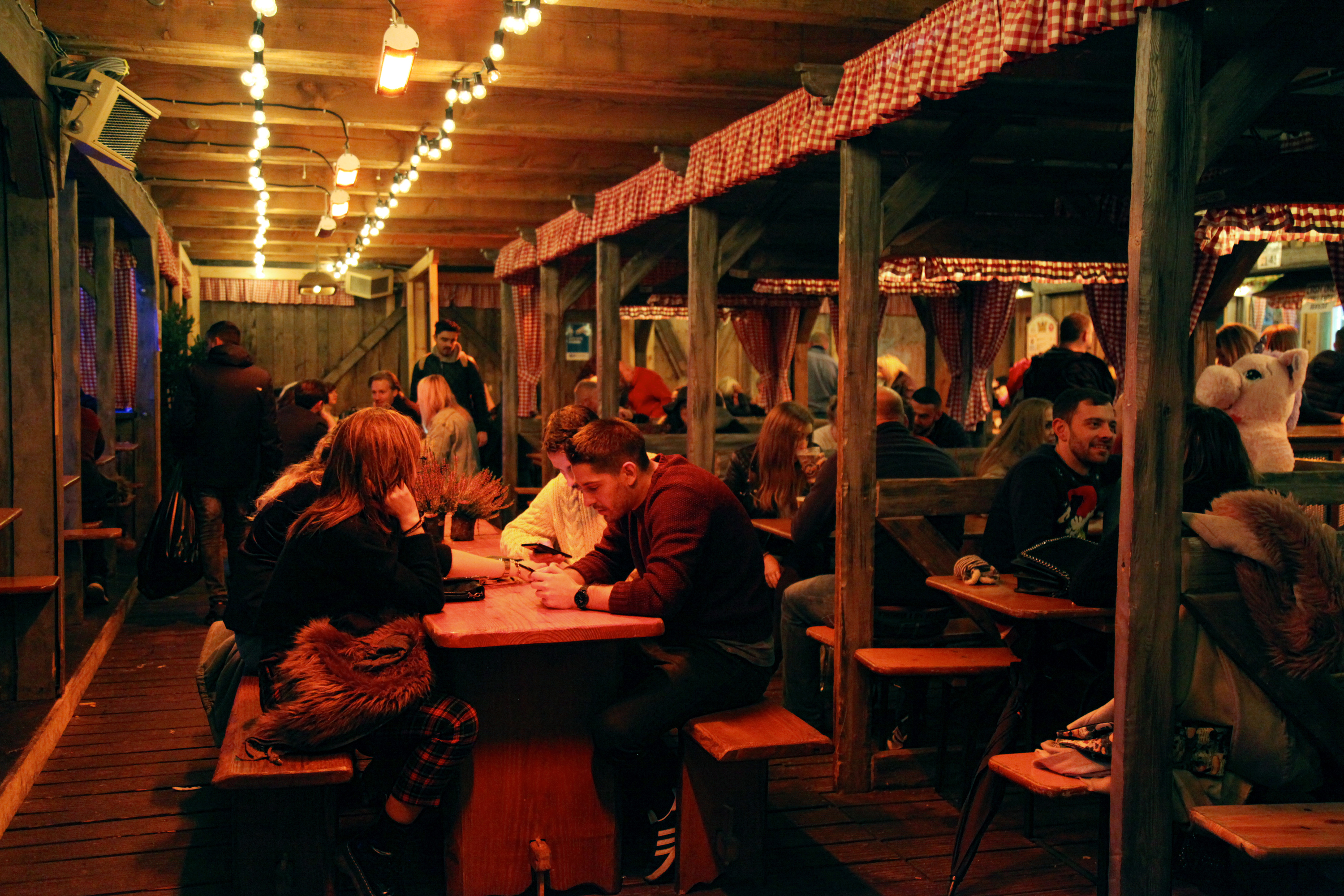 Rustic Cafe Bavaria venue with warm lighting for casual gatherings and themed events.