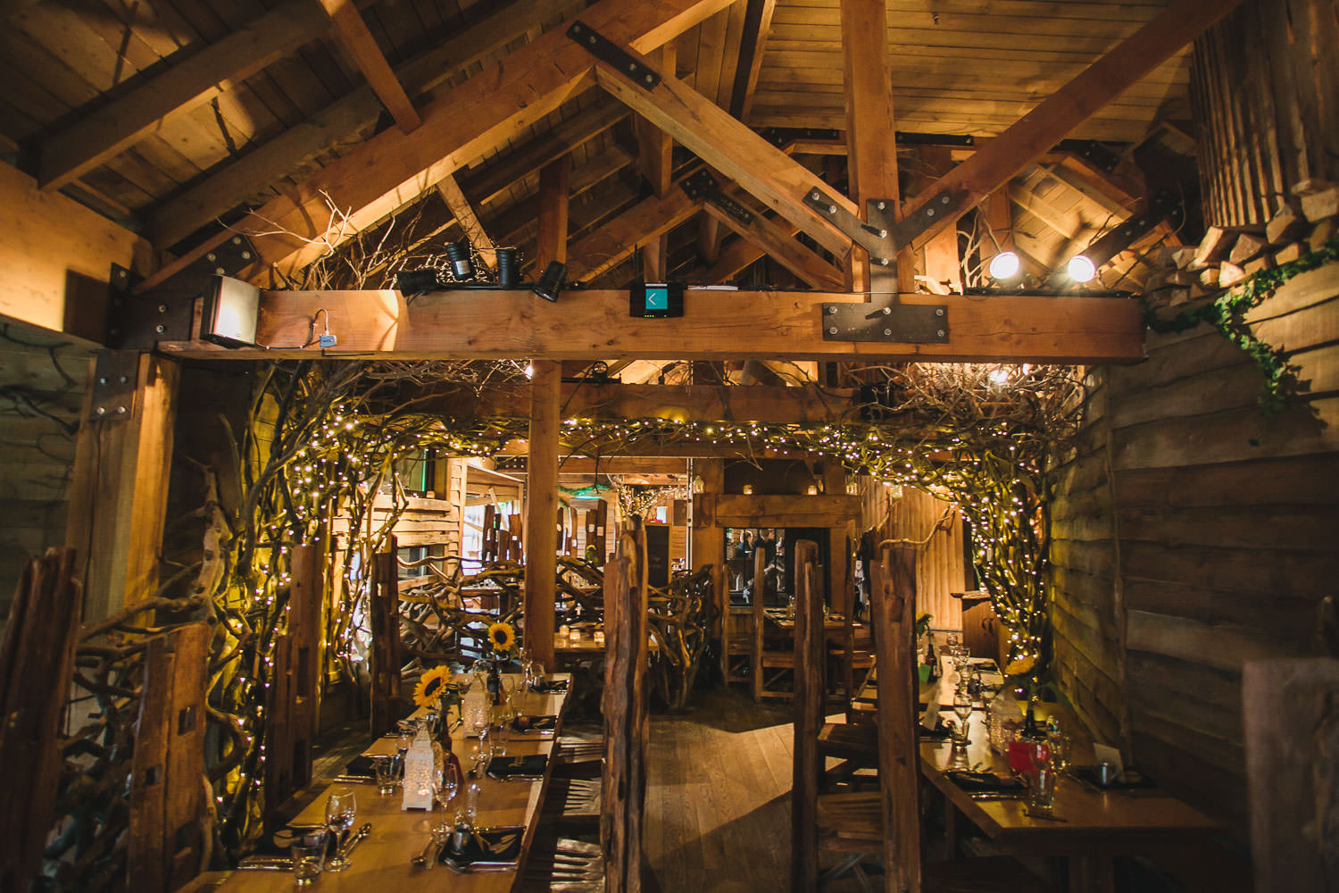Rustic Treehouse venue with wooden beams, ideal for intimate weddings and gatherings.