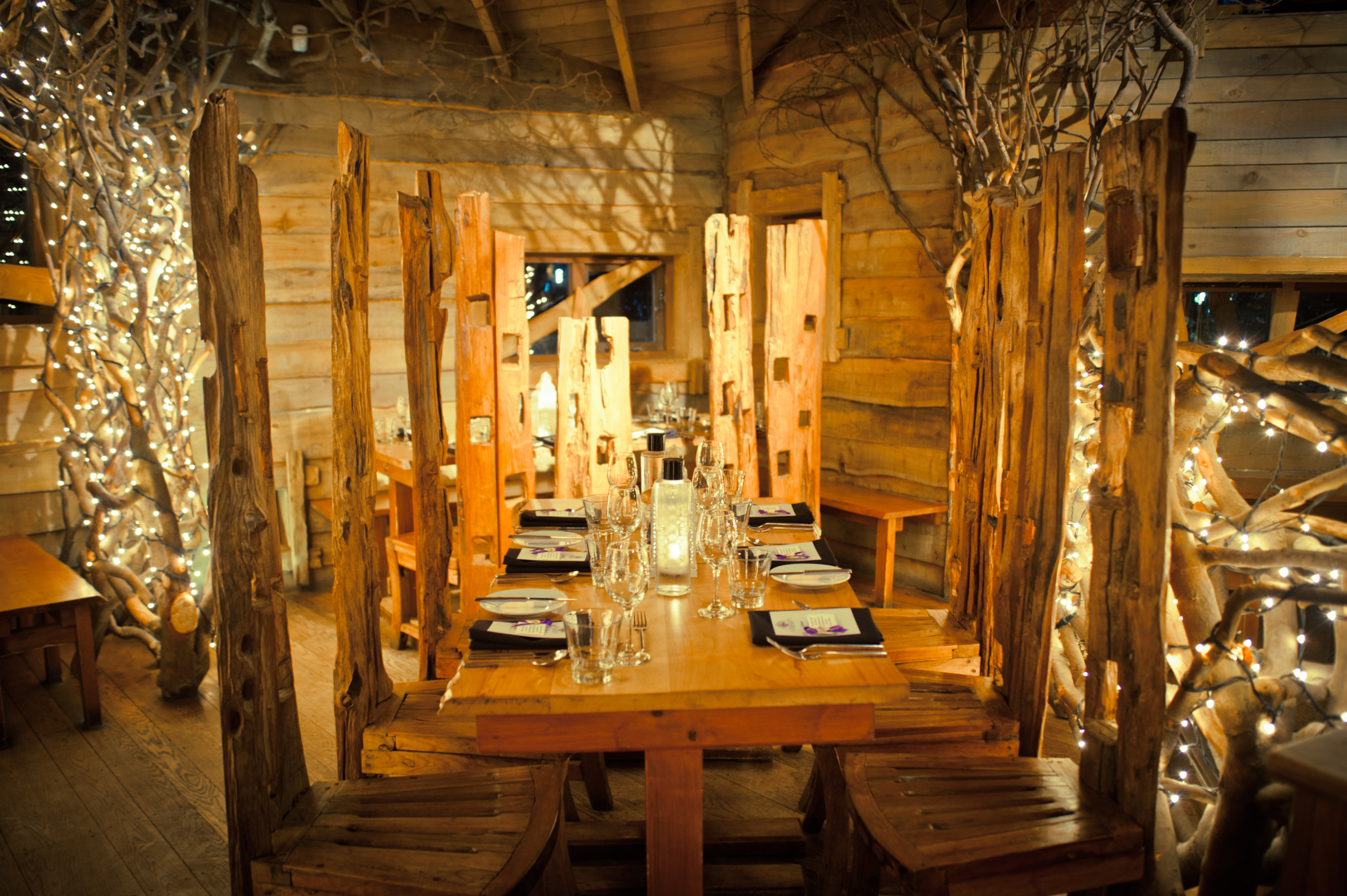 Cozy rustic dining space in The Treehouse, ideal for intimate gatherings and events.