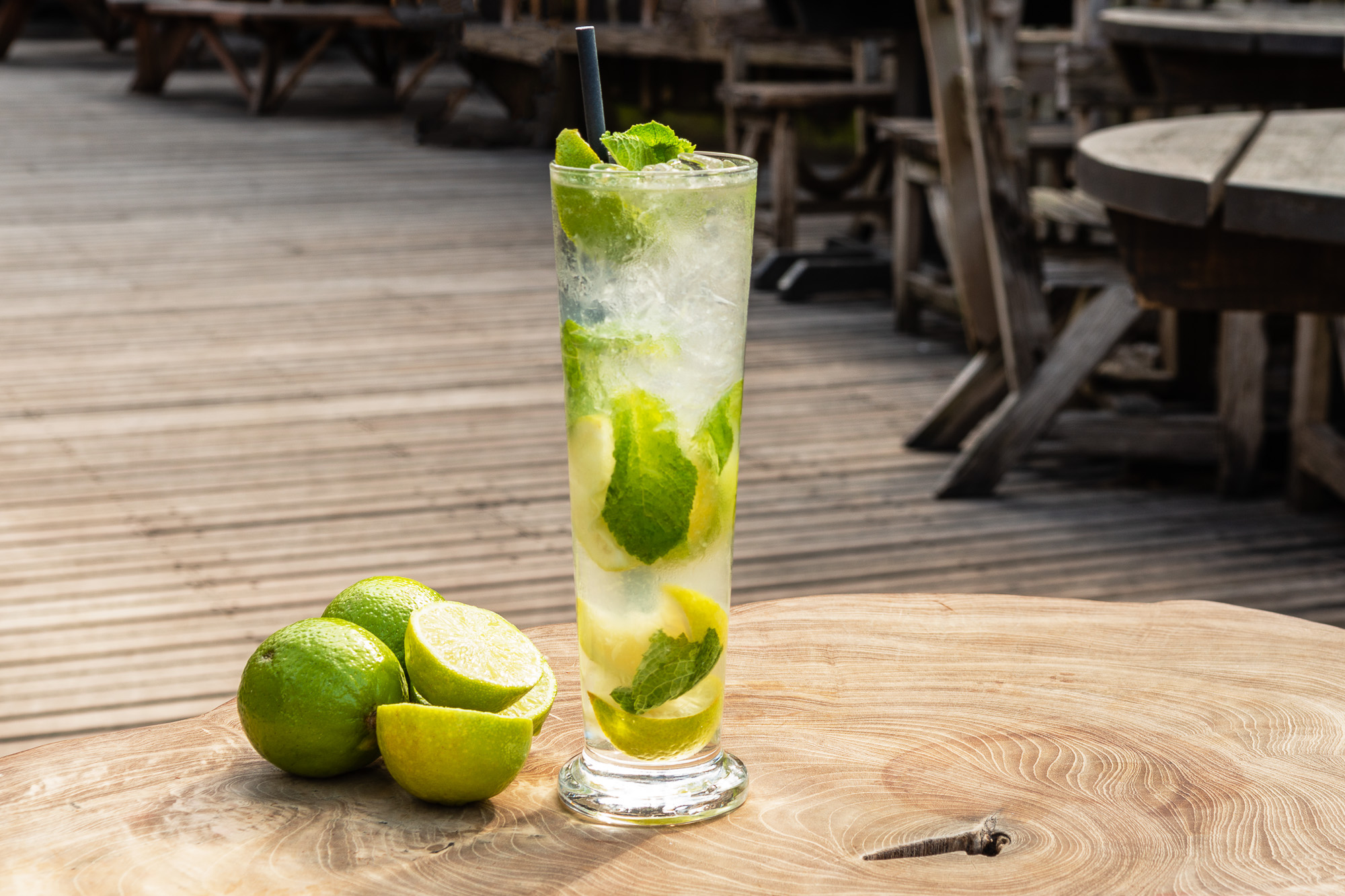 Refreshing mojito cocktail in tall glass, ideal for summer events and outdoor networking.