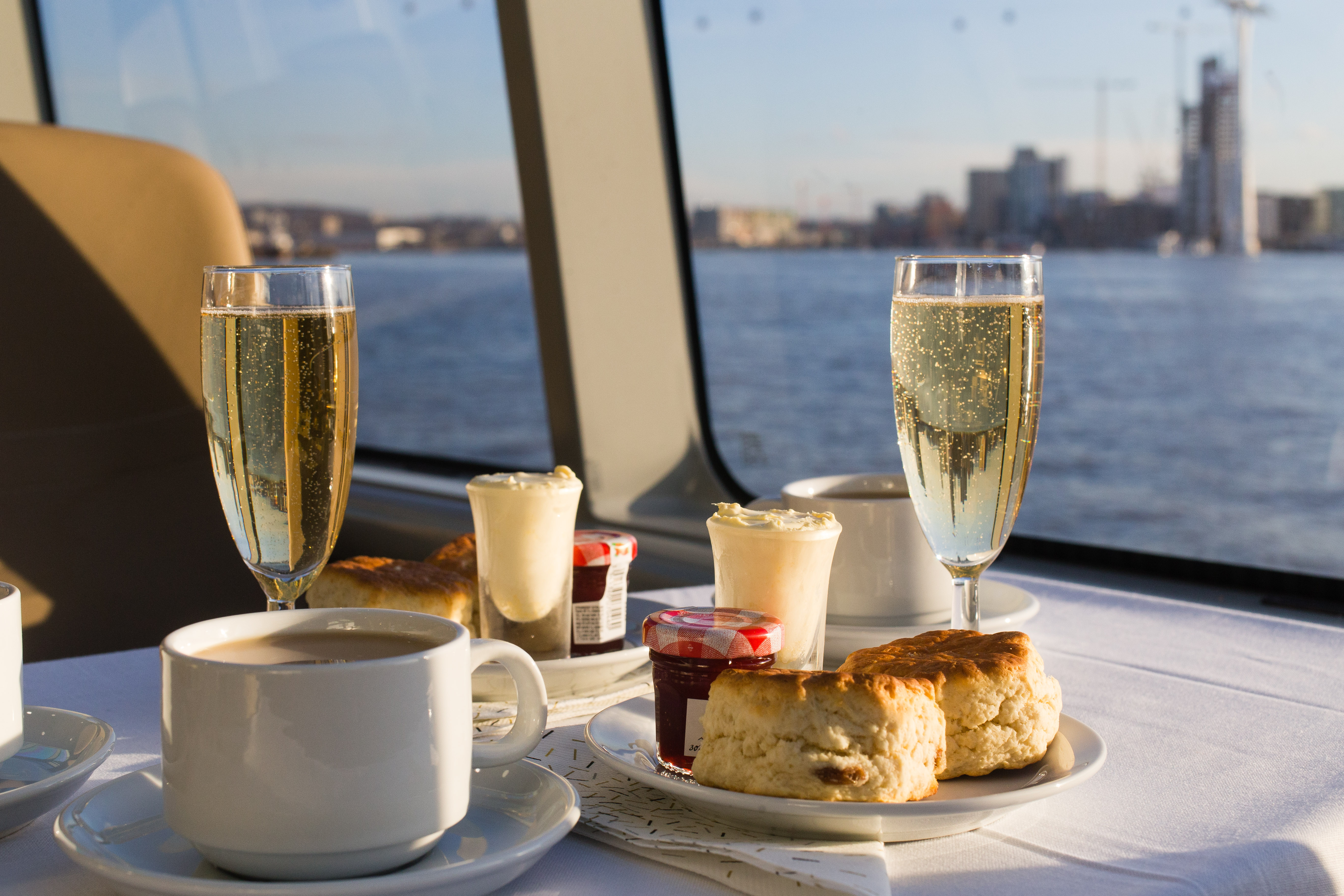 Elegant meeting setup on Venus Clipper with waterfront view, ideal for networking events.