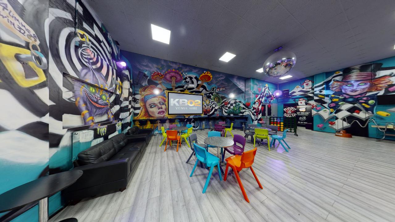 Vibrant event space with bold murals, ideal for workshops and corporate meetings.