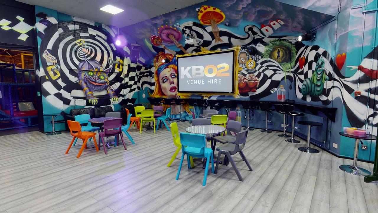 Vibrant event space with bold murals, ideal for creative meetings and gatherings.